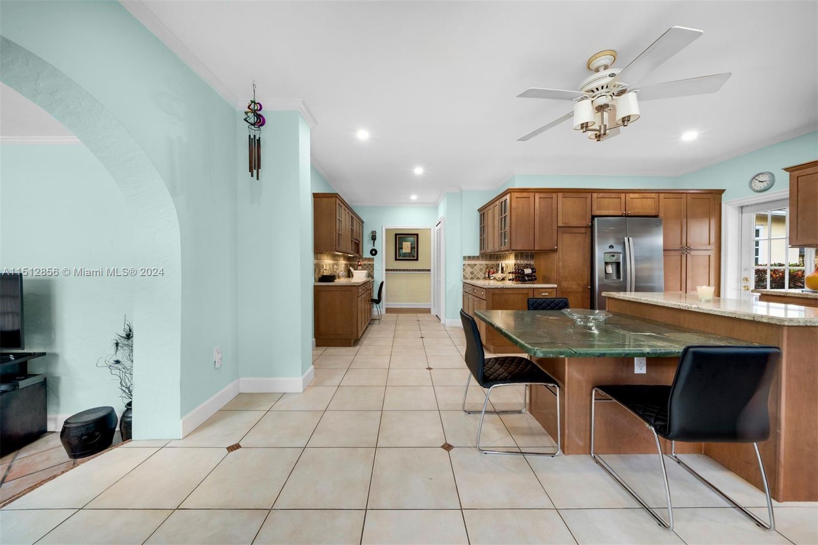 Kitchen Area Offers Custom Built-in Desk