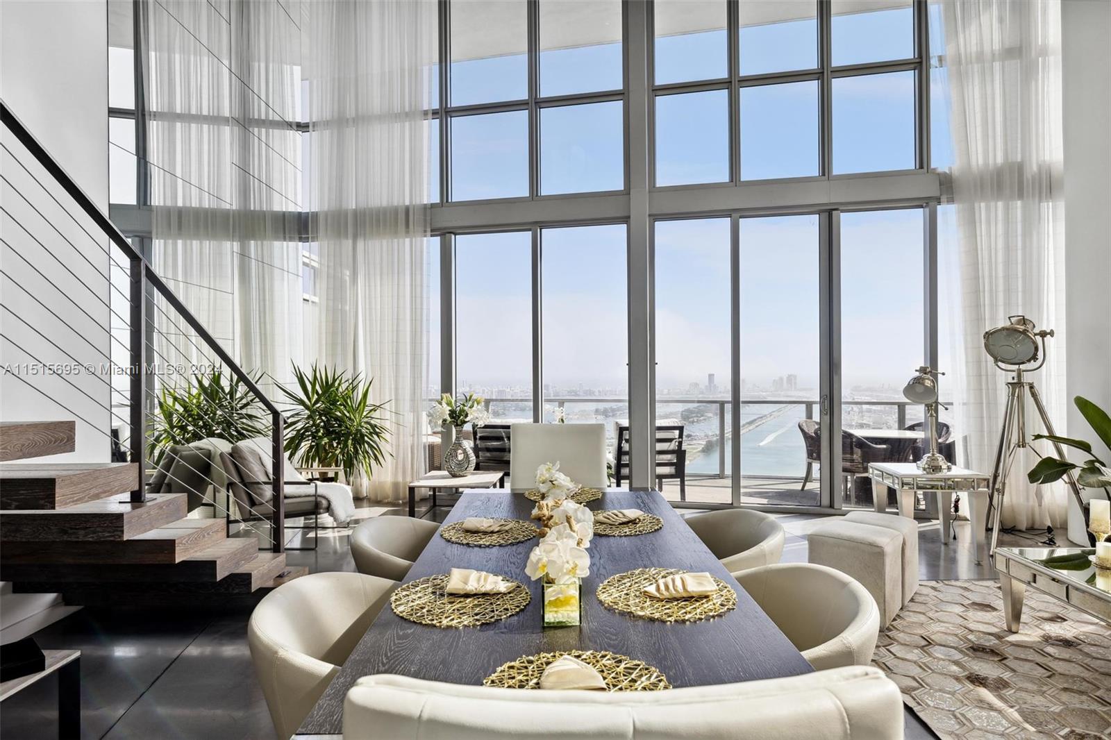 This exceptional 3-level penthouse, perched on the 63rd floor, features 3 bedrooms and 4.5 bathrooms, along with a spacious office/studio easily convertible into a 4th bedroom. The residence showcases a sleek, modern design, complete with a wine cellar, floating staircases, and an impressive 22-foot ceiling. It spans 3,381 square feet, complemented by an additional 1,028 square foot rooftop terrace. This outdoor haven offers a dining area and private Jacuzzi, perfect for entertaining and enjoying panoramic views of the city skyline, ocean, and Biscayne Bay. The unit includes 2 assigned parking spaces. Located in Downtown Miami's vibrant heart, it is just minutes from Miami Beach, Brickell, Wynwood, Design District, and directly across from Museum Park, housing The Perez Art Museum and more