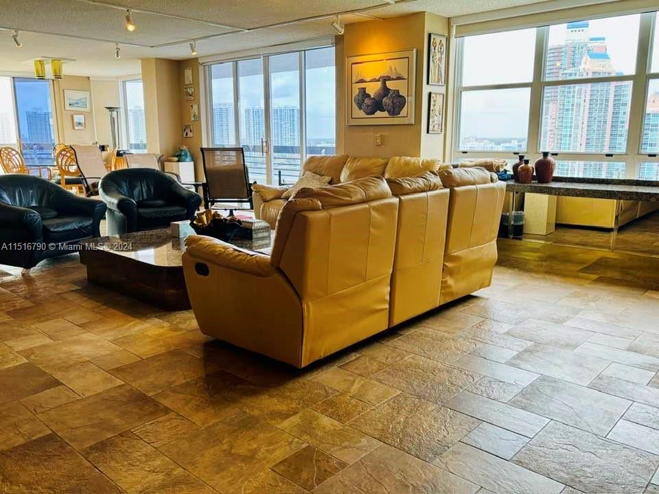 a superb double-sized living room facing south/south-west and leading to a balcony