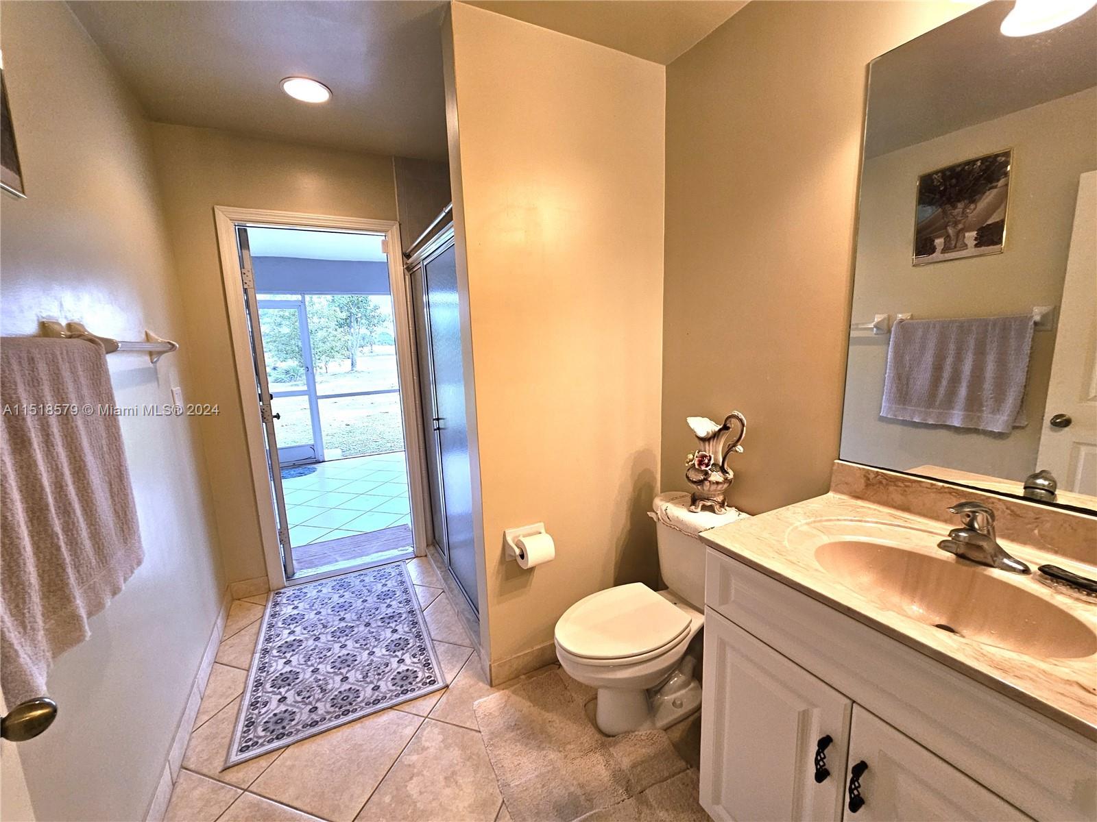 Bathroom #2 exit to Screened Porch, an ideal Cabana Bath for the future