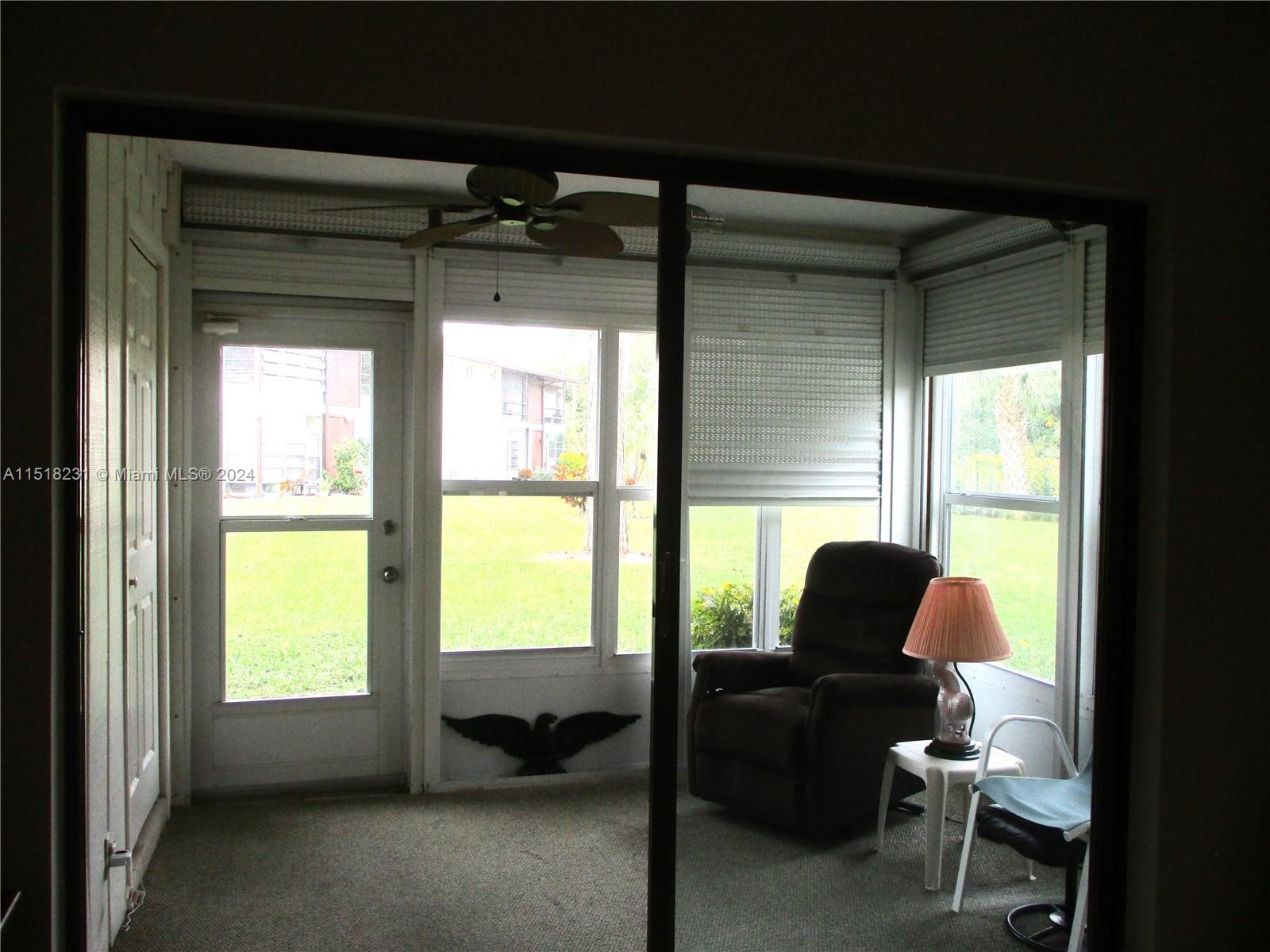 ENCLOSED PATIO WITH WASHER/DRYER IN STORAGE AREA ON LEFT.  ROLL DOWN SHUTTERS FOR YOUR PRIVACY