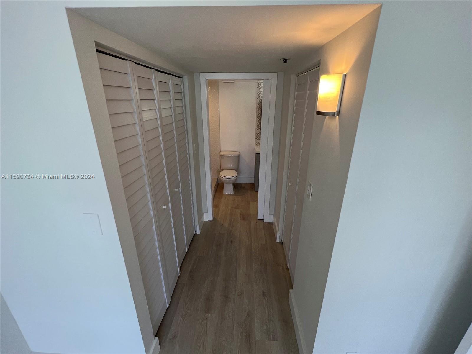 Hallway to closets and bathroom