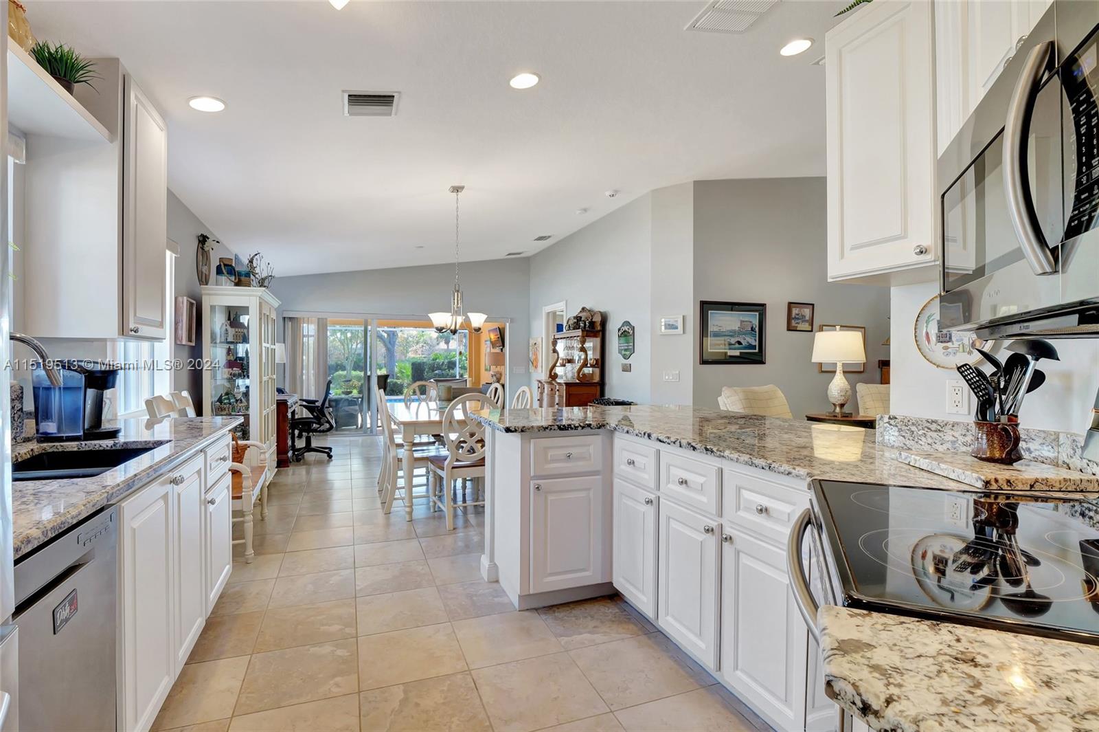 Beautifully upgraded & open kitchen with granite countertops & SS appliances