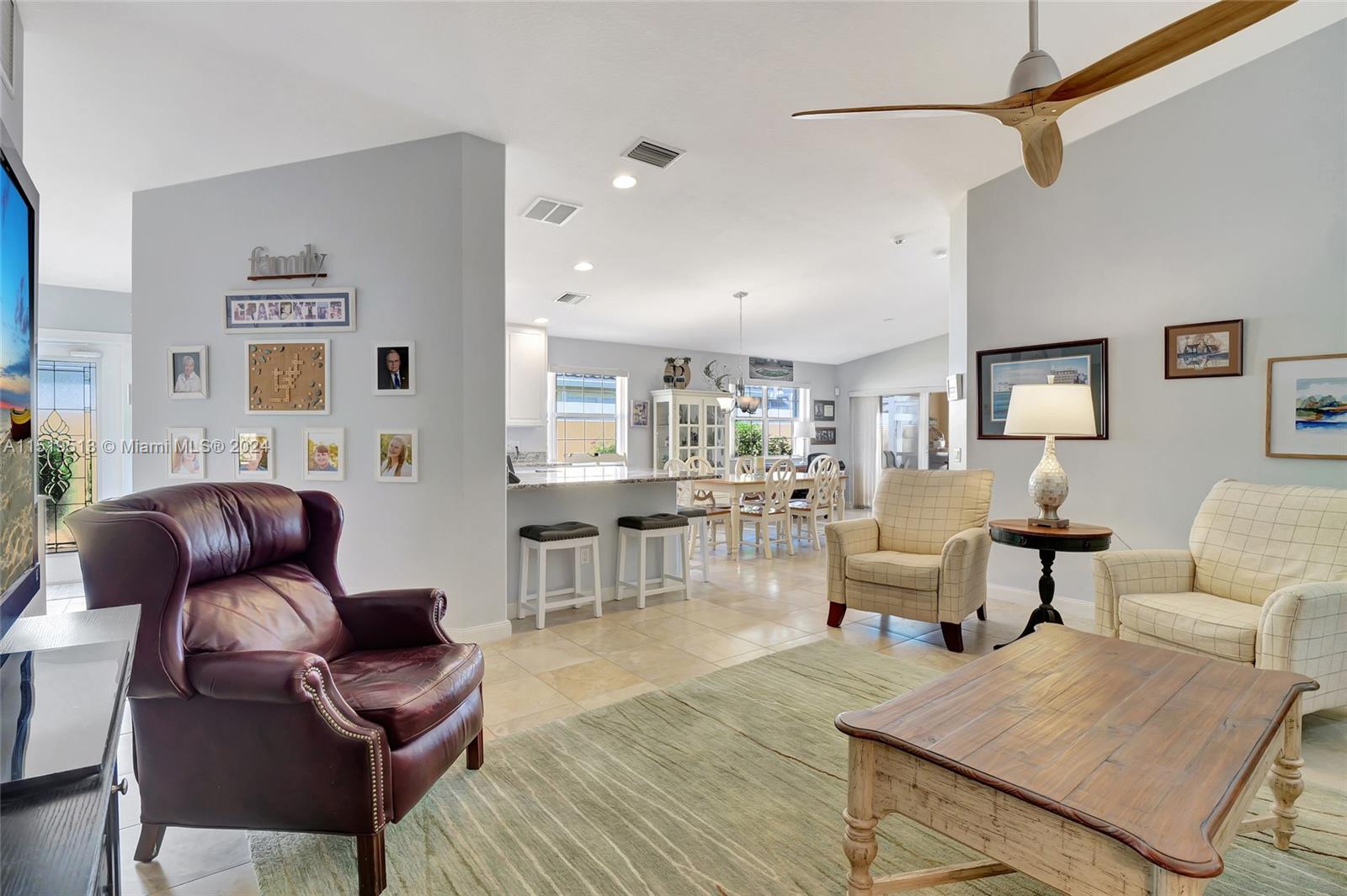 Living room overlooking foyer area & kitchen/dining area