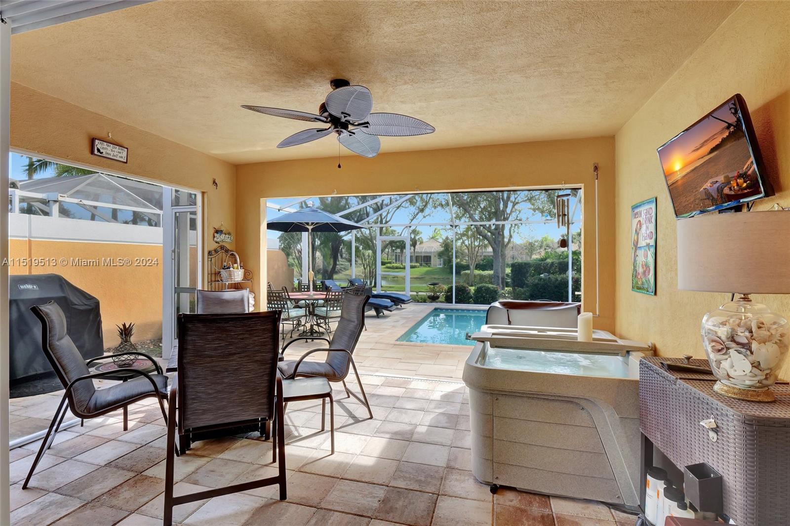 Covered lanai with ceiling fan & roll down storm protection