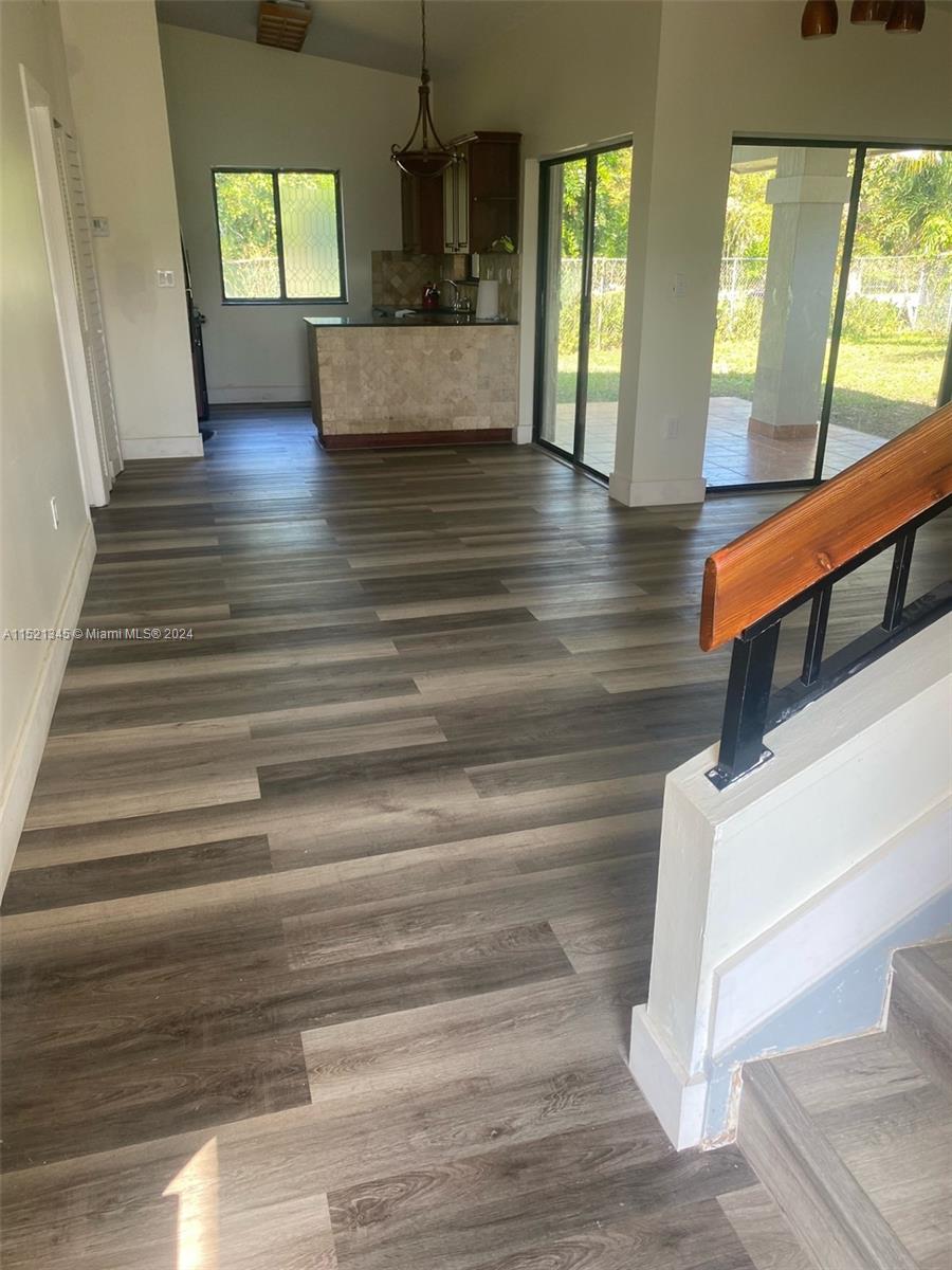 At entrance, looking towards the living room and the kitchen