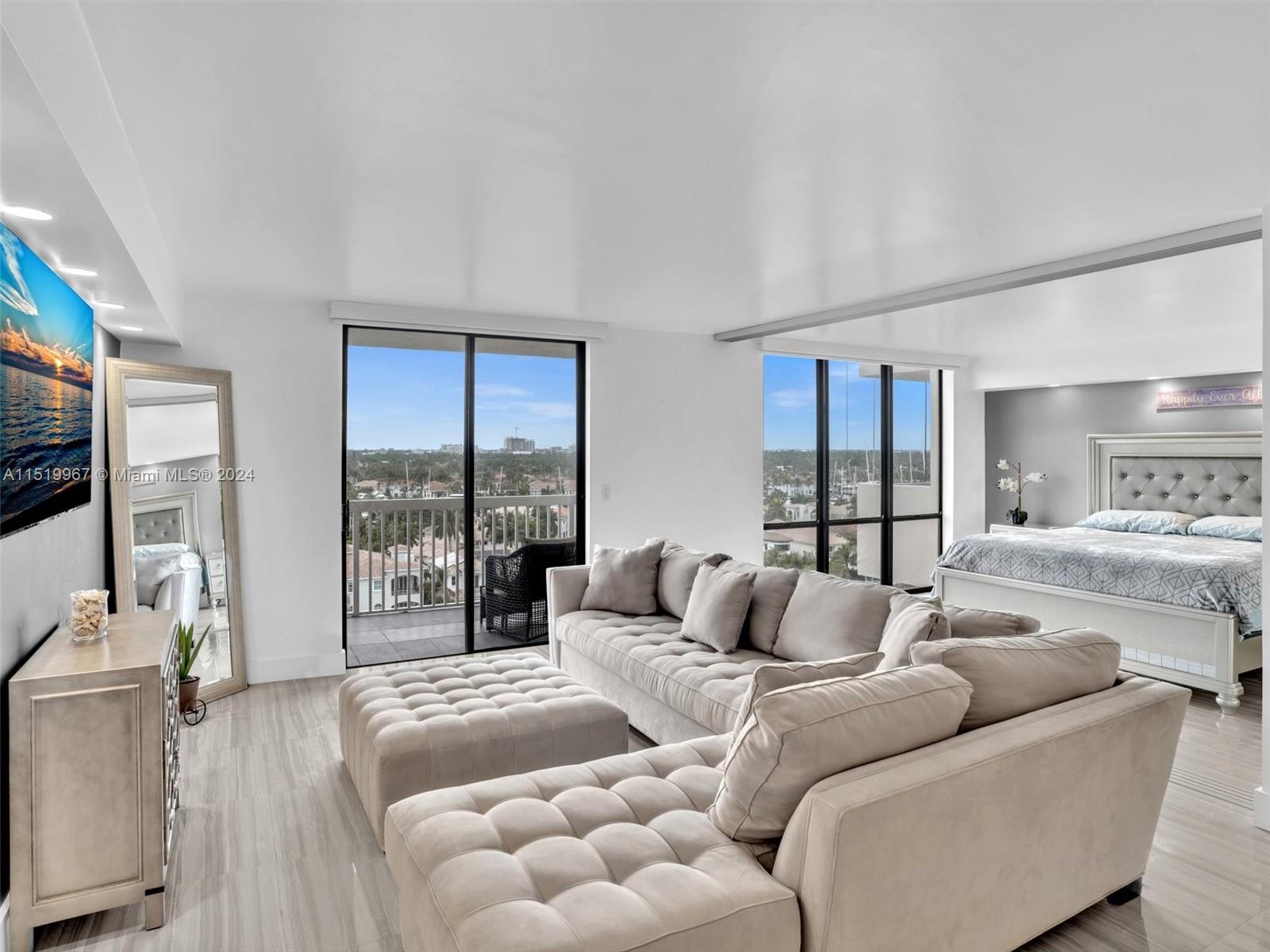 LIVING ROOM WITH SECOND BEDROOM FEATURES MODERN SLIDING DOORS TO SEPARATE THE SPACE