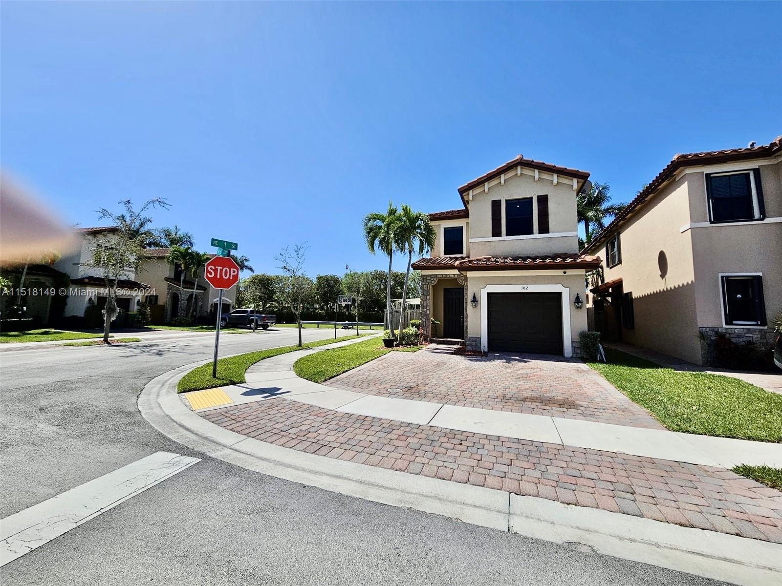 Front Elevation with Paverd Driveway