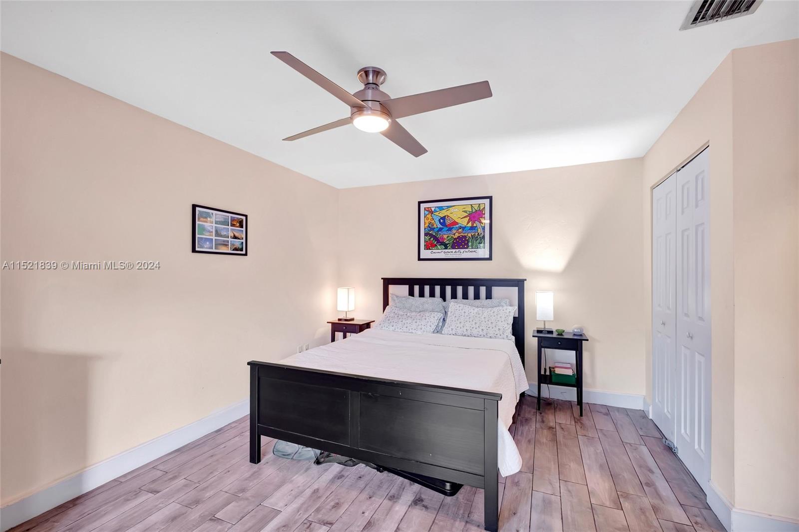 Master bedroom with his and hers closets