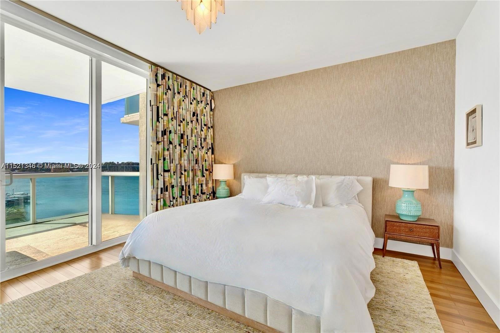 MASTER BEDROOM WITH ACCESS TO BALCONY AND MAGNIFICENT UNOBSTRUCTED WATER VIEWS