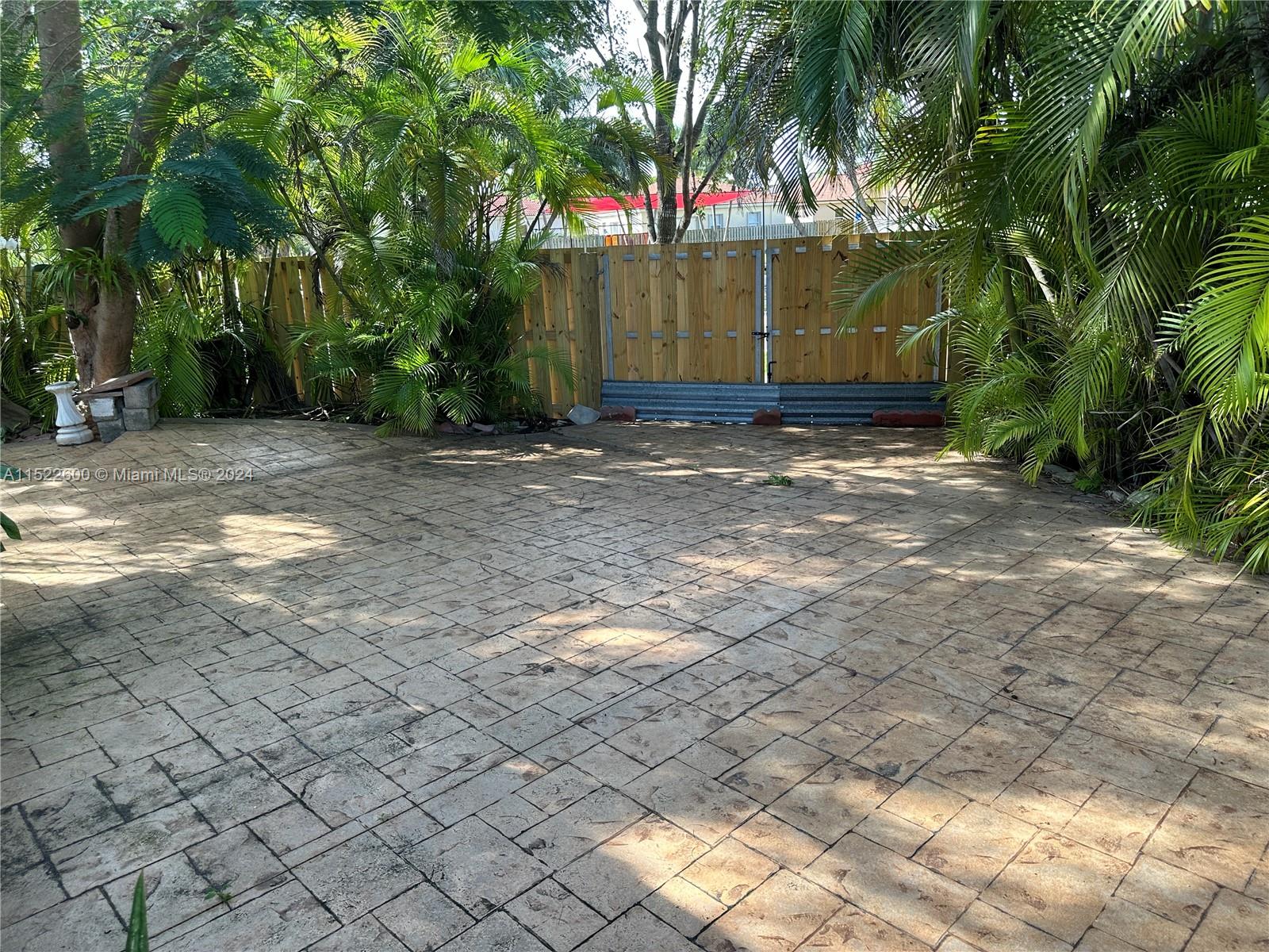 Backyard with double gate for boat entrance