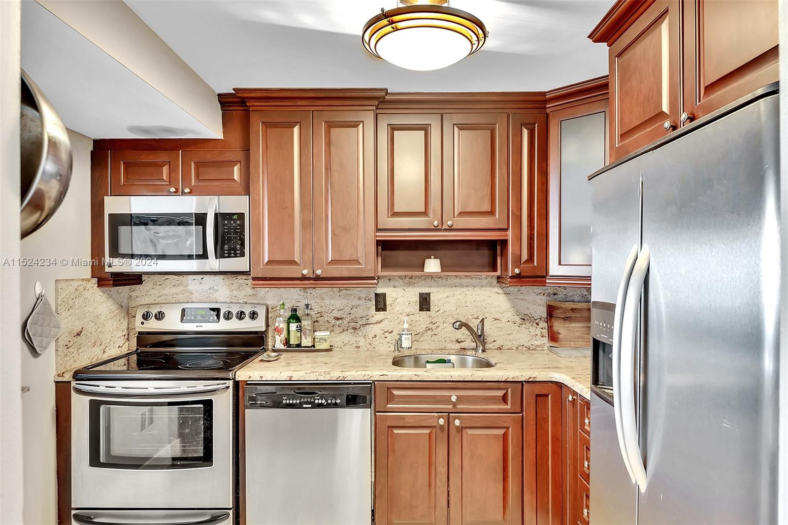 Tastefully Remodeled Kitchen, Granite counters and stainless steel appliances.