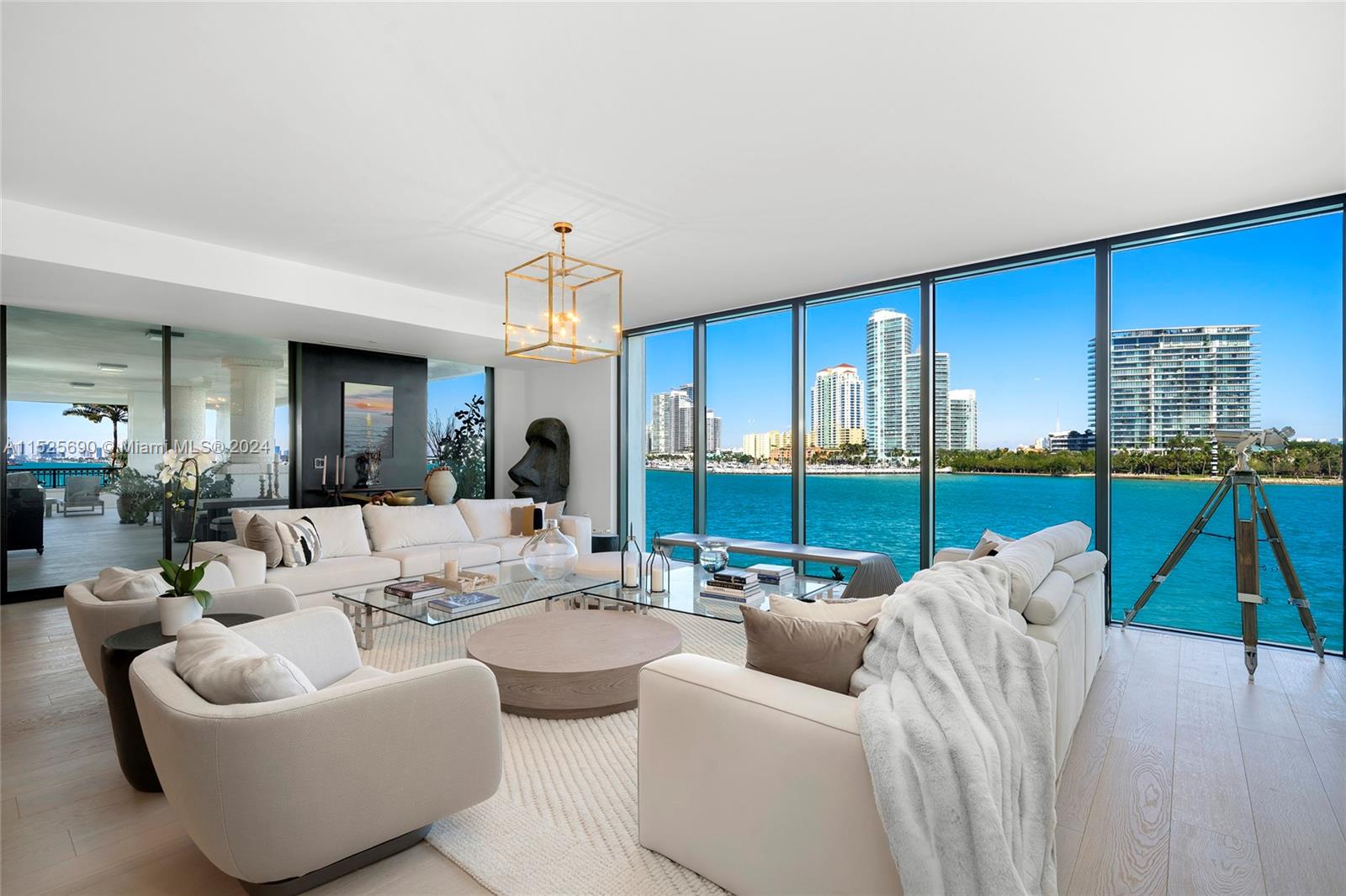 This stunning contemporary corner unit at the Palazzo Della Luna is offered furnished. Private elevator entry, featuring 4BR/4+1BA and 4,904 SF of luxury. Wide plank oak wood floors throughout, extended flow through family, dining &amp; living room with access to a wraparound terrace made to entertain w/direct views to Biscayne Bay, Government Cut, Miami Beach &amp; Ocean. Custom Boffi designed kitchen features granite countertops, top-of-the-line Miele &amp; Sub-Zero appliances. Elegant principal suite surrounded by walls of glass w/direct water views, dual walk-in closets &amp; beautiful bathroom w/Carrara marble rain shower &amp; soaking tub. Three other bedrooms are each spacious w/en-suite bathrooms. The unit boasts one of the largest wraparound terraces &amp; combined with a back terrace totals 2,417 SF.