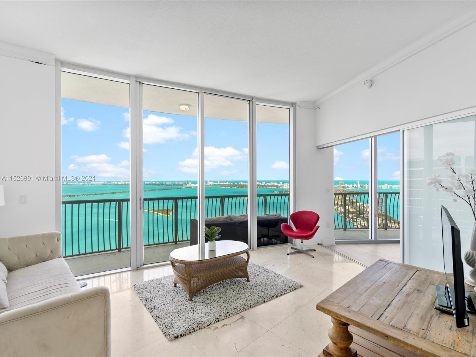 Now Available! Top floor Penthouse unit on 56th level in the coveted '01 line. Endless Eastern views of Biscayne Bay & Miami Beach. Furnished or unfurnished 2 bd/ 2 ba, 12-foot high ceilings, washer/dryer in unit, & premium parking space on 2nd level. The Opera Tower has a new state-of-the-art fitness center & pool, facial recognition entry, 24 hr Mini Market, wine market, barber shop, restaurant and bar on-site, 24/7 Valet, & Security. Outside your front door is Pura Vida, Cassadonna, and Margaret Pace Park w/ Tennis, Volleyball, Basketball, Jogging Path, Dog Park, BBQ, etc. In popular Edgewater area, minutes from Downtown, Arts & Entertainment District, Wynwood, Midtown & Design District, 10 min to South Beach & steps to pedestrian-friendly Venetian Causeway. No Short Term.