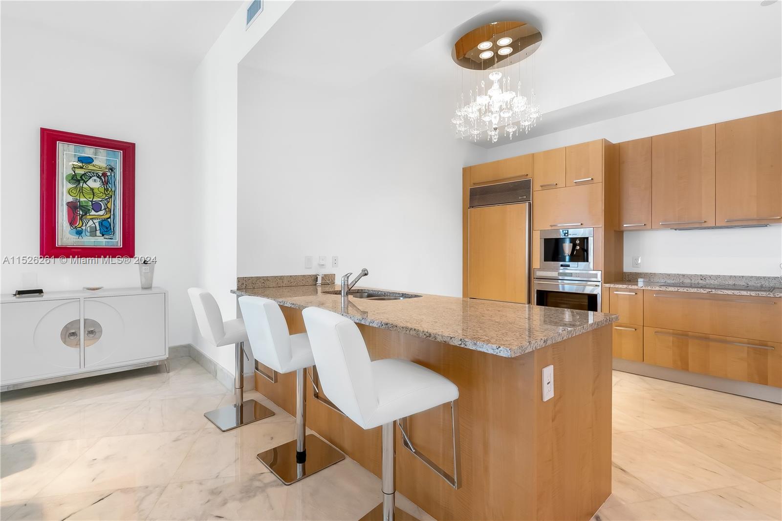 Italian Cabinetry, Marble Counters, High-end Stainless Steel Appliances, Glasstop Cooking, Built in Espresso Maker & Microwave