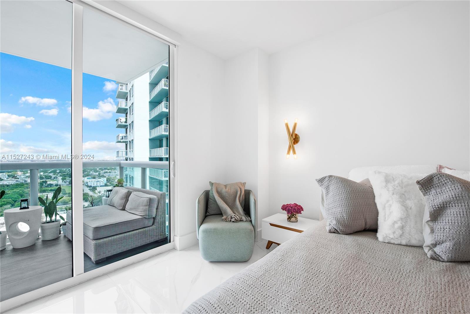 Spacious primary bedroom full of natural light
