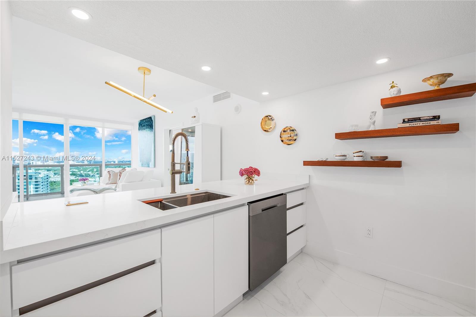 28-inch workstation sink + gold Kohler professional sink faucet + garbage disposal