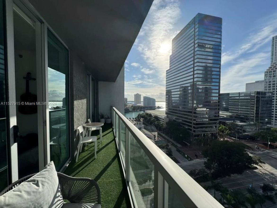 Stunning 1-bed apartment with city and water views. Features a modern kitchen with stainless steel appliances, in-unit washer and dryer, and a spacious balcony with access from the living room and bedroom. Enjoy luxurious amenities including pools, sauna, gym, theater, massage room, and club rooms. Dedicated parking space and convenient location next to Brickell City Center with easy access to I-95. Ready for immediate move-in and easy to schedule a showing.