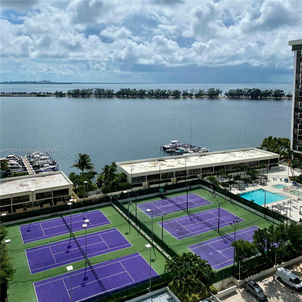 This unit has it all! Soothing view to the ocean and city, updated kitchen, plenty of storage, washer/dryer in unit. Building has great amenities, pools, tennis courts, gym, business center.  Living in Brickell is a lifestyle, walking distance to restaurants, shops, parks, grocery stores.