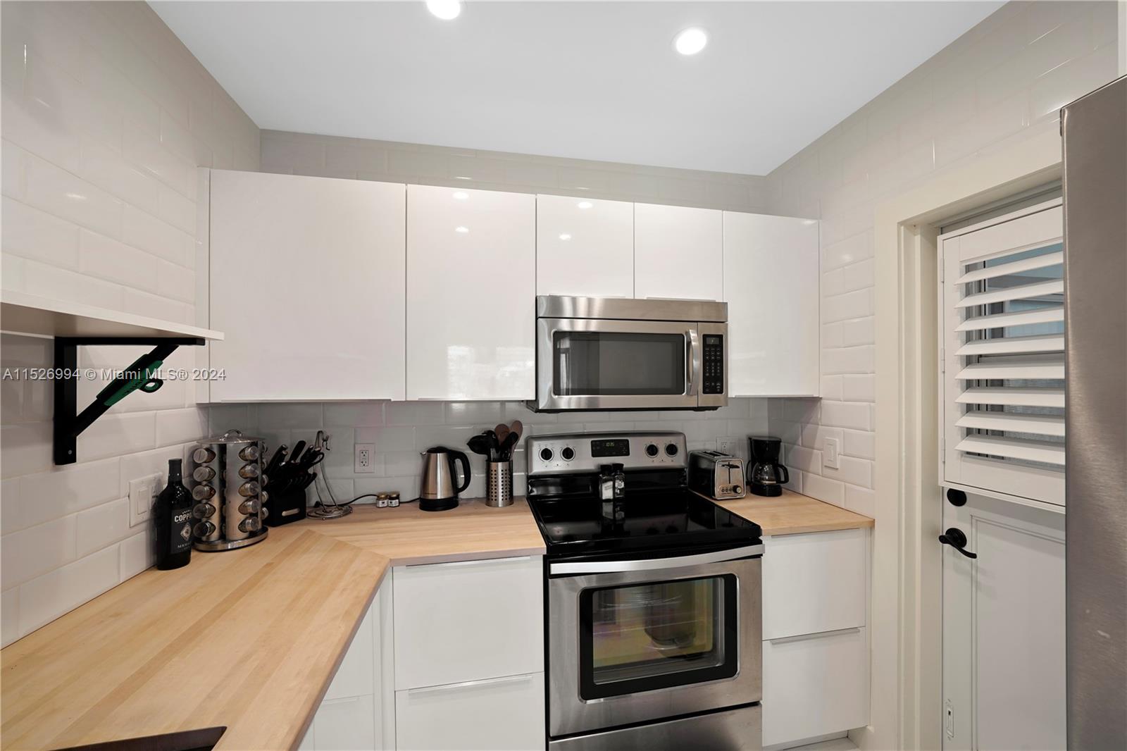 OPEN SHLEVING, SECONDARY DOOR, BUTCHER BLOCK COUNTERTOPS