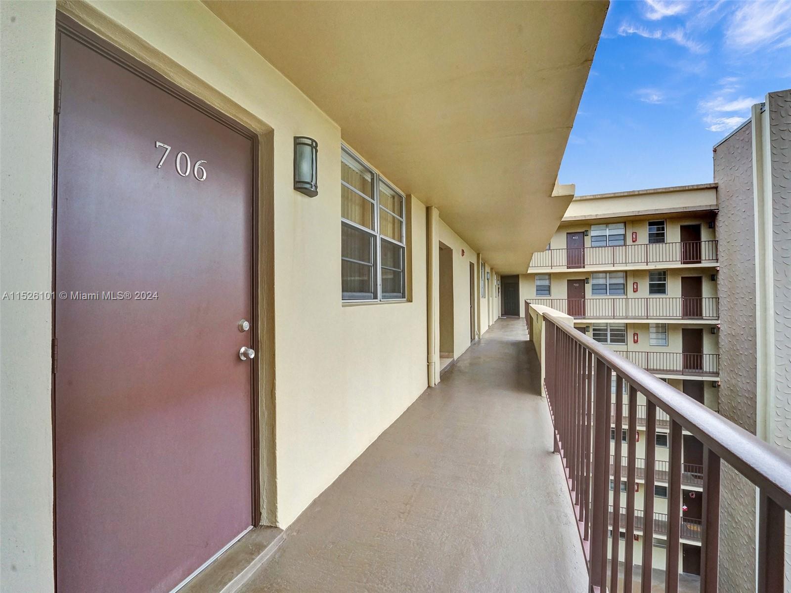 Entrance to unit of very well maintained and managed building