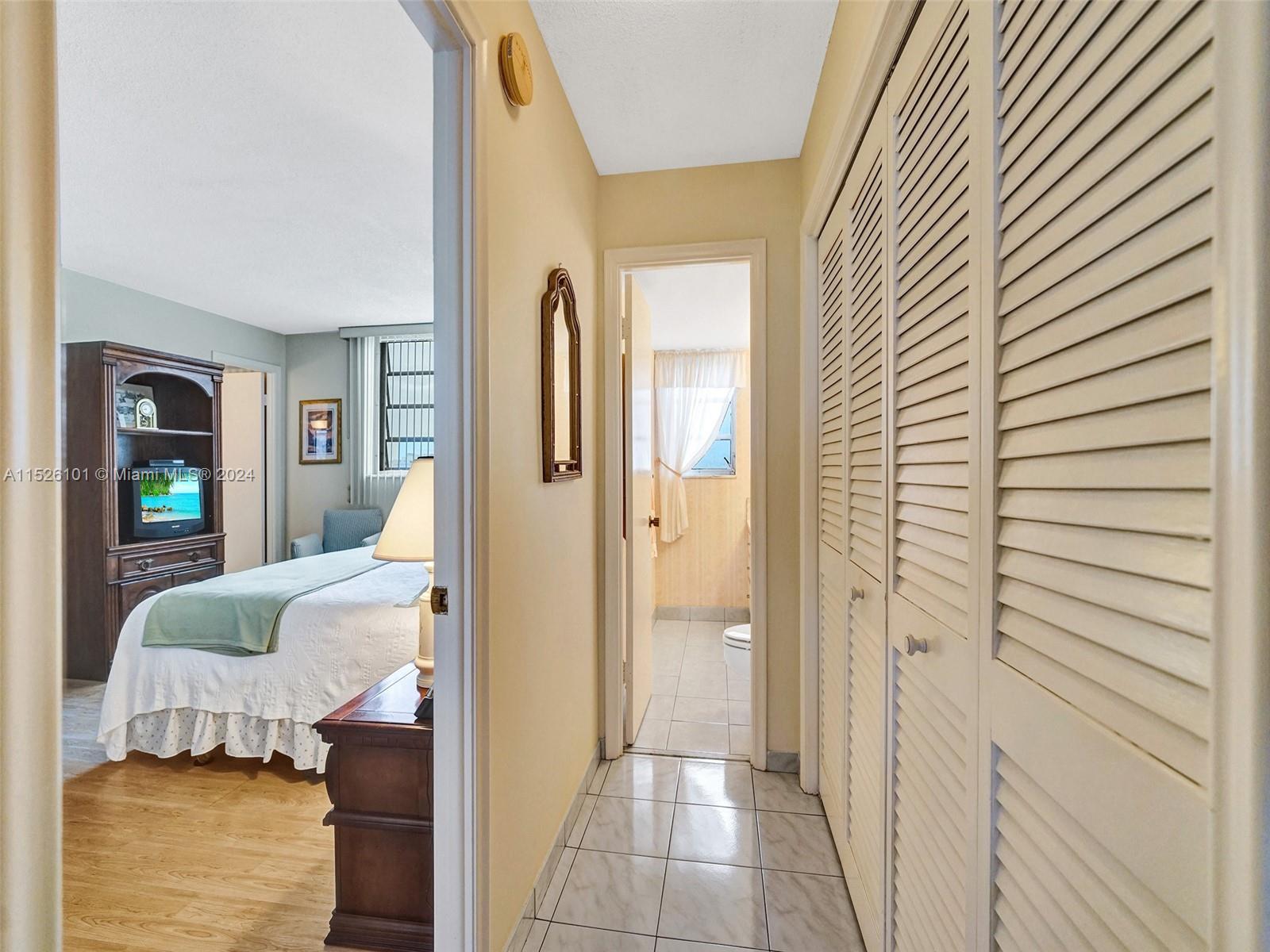 Hallway to guest 1/2 bathroom and lot's of storage.