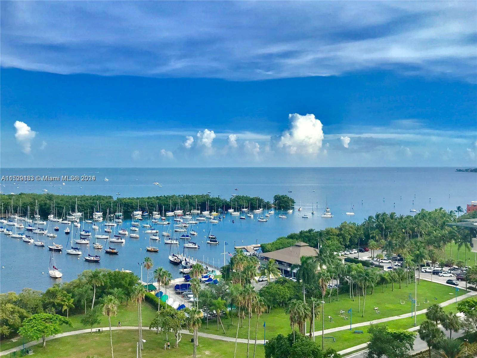 Coconut Grove, incredible bay view! Bayshore Drive, excellent opportunity to own at the lowest price in prestigious Yacht Harbor. Open kitchen, spacious condo, balcony is approximately 250 sq. ft. Storage closet included. Doorman building, valet parking, gym, tennis, pickle ball, huge swimming pool. Walk to the sailing club, Cocowalk, restaurants, movies, galleries, parks, library, hotels, post office.