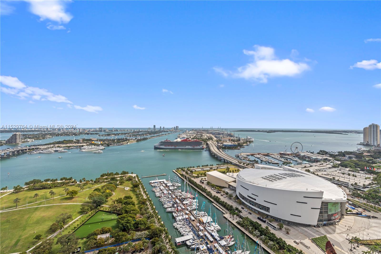 Enjoy spectacular, unobstructed direct views of Biscayne bay & city from this bright 3/3 flow through apartment. Exceptional features include: private elevator entry,10 foot ceilings, porcelain floors throughout, granite kitchen countertops, Italian cabinetry, Miele & Subzero appliances, custom closets & 2 balconies. All bedrooms have access to a large balcony. Third bedroom is not enclosed. Building offers top of the line amenities:2 pools, movie theater, fitness center/spa, 24-hour security, valet, concierge and doorman.