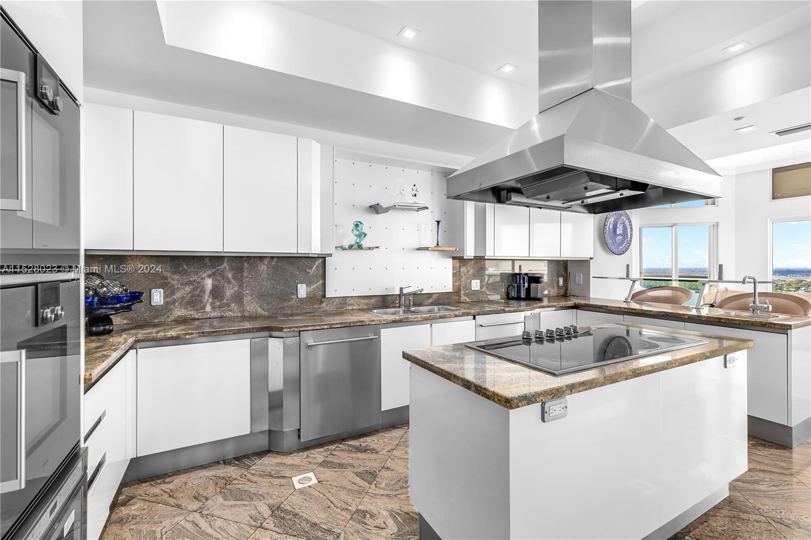 Large kitchen with Sub-zero and Gaggenau appliances.