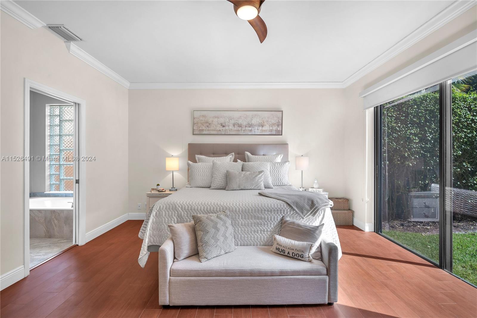 Master bedroom with ceramic tiles and views overlooking the lake