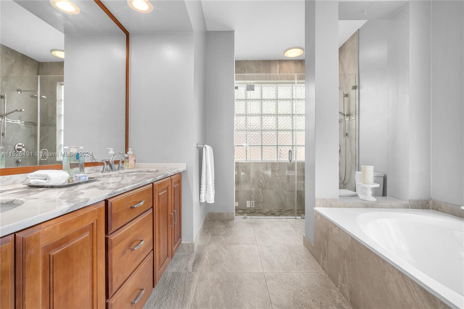 Updated master bathroom with marble countertops