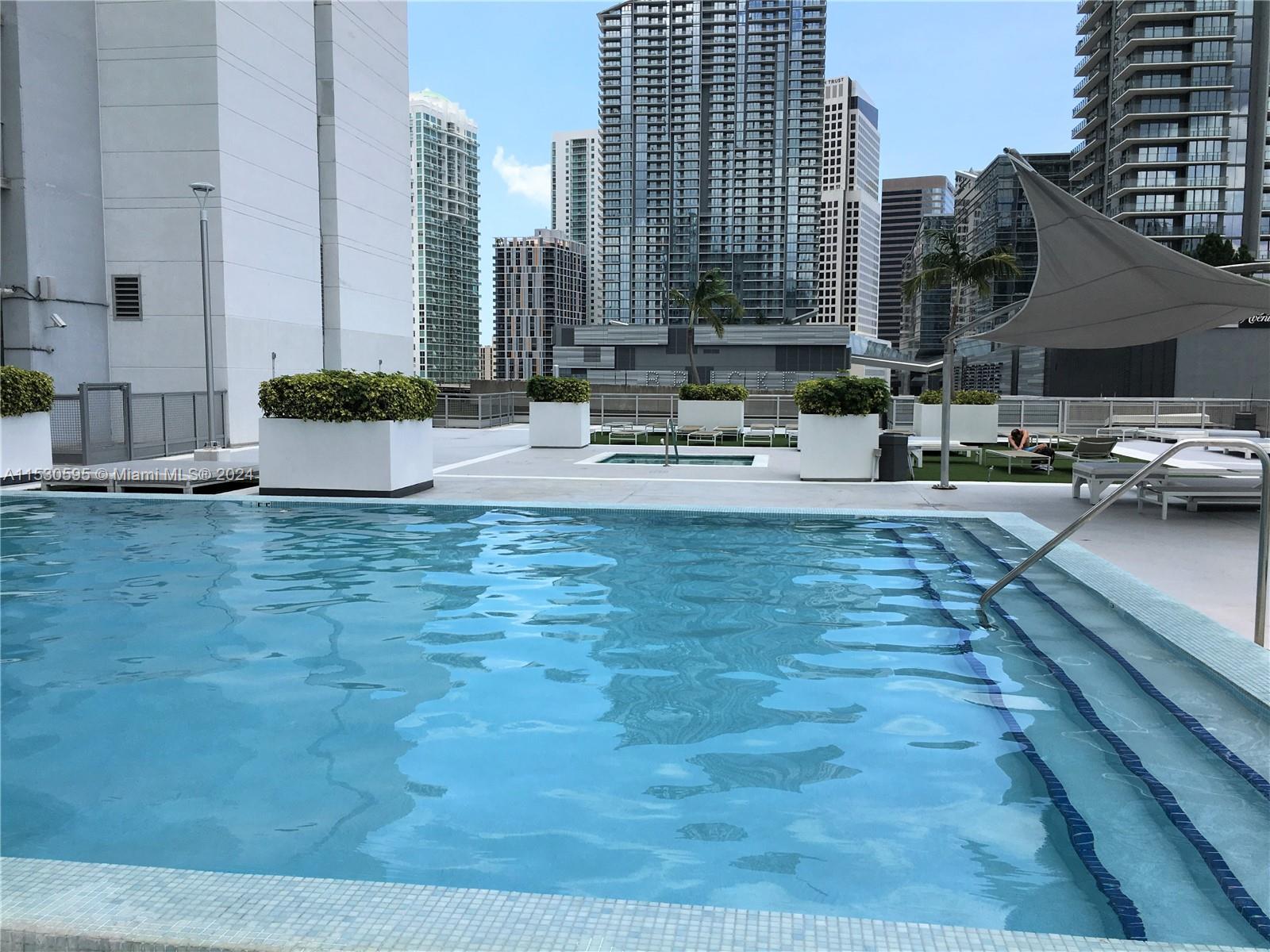 The most sought after area in Miami; Brickell! Excellent riverfront building located half block from Brickell City Center, Mary Brickell, Metrorail and Metromover, Miami water taxi, supermarkets, restaurants, bars, shops, movie theaters. 21st floor unit with 170 sq ft balcony overlooking the pool and city. This modern 1 bedroom unit has white appliances, granite countertops; washer and dryer inside. The bedroom is divided by a floor to ceiling Glass walls and a sliding door partition.On the 8th floor is a 49,000 square foot oasis offering a pool, gym, poolside cabanas, volcanic rock sauna, racquetball courts, rooftop lounge, concierge services. Security, 24 hour valet service, assigned parking space . Year lease only. No Pets allowed in the building for tenant's .