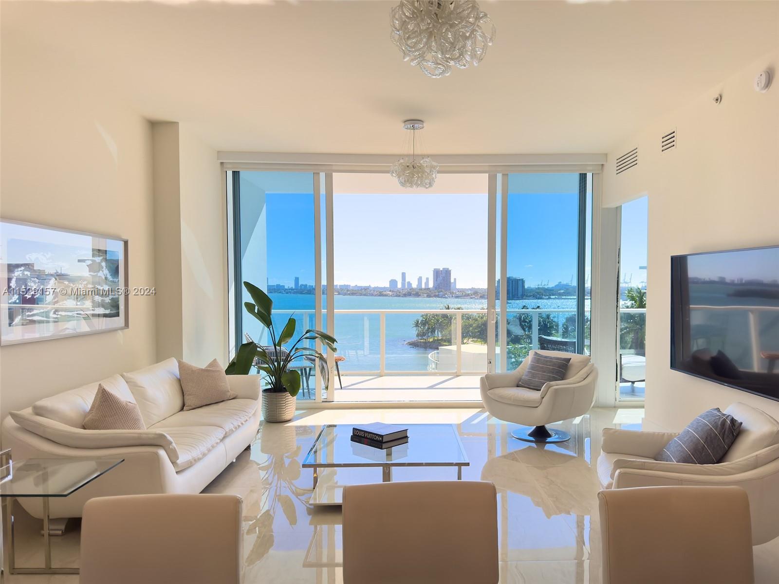 Stunning 2-bed, 2.5-bath condo at Paramount Bay, one of Miami’s most prestigious addresses. Enjoy the spacious and elegant open floorplan that seamlessly blends the living, dining, and kitchen areas, while keeping the bedrooms private and cozy. Step out to the two balconies and marvel at the breathtaking water views from sunrise to sunset. This condo is in the best line of the building and boasts brand-new floors, custom doors, electric motor shades, top-of-the-line Wolf/Subzero appliances, and a versatile den that can easily convert into a third bedroom or a large office. Paramount Bay offers a 5-star lifestyle with world-class amenities with two pools, library, private offices, BBQ, gym and spa, Pilates studio, teen and kid's room, club room, valet, concierge, and more.