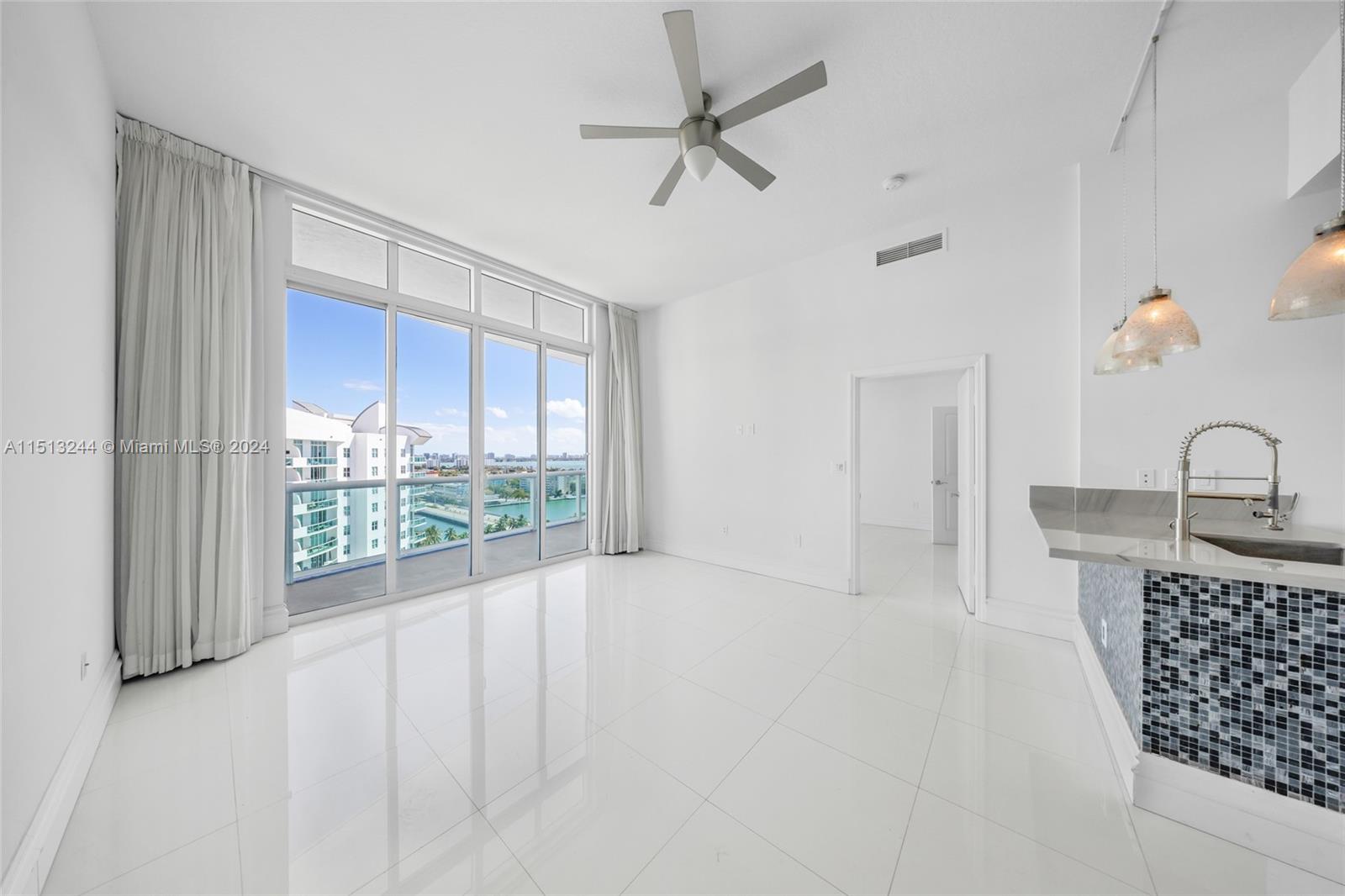 Gorgeous 2 bed & 2 bath Penthouse in North Bay Village!!! This amazing unit features 10 ft ceiling, white marble flooring throughout the entire unit, glass sliding doors to enjoy beautiful intracoastal & pool views from the balcony which is accessible from the living room & master bedroom allowing plenty of natural light to come in. Open kitchen with Italian cabinetry & brand new stainless steel appliances and washer and dryer. Master Bathroom offers stand up shower & roman tub. This unit also comes with 2 assigned garage spaces. The 360 condominium offers a variety of amenities like Gym, sauna, pool, & Jacuzzi access. MUST SEE !!!