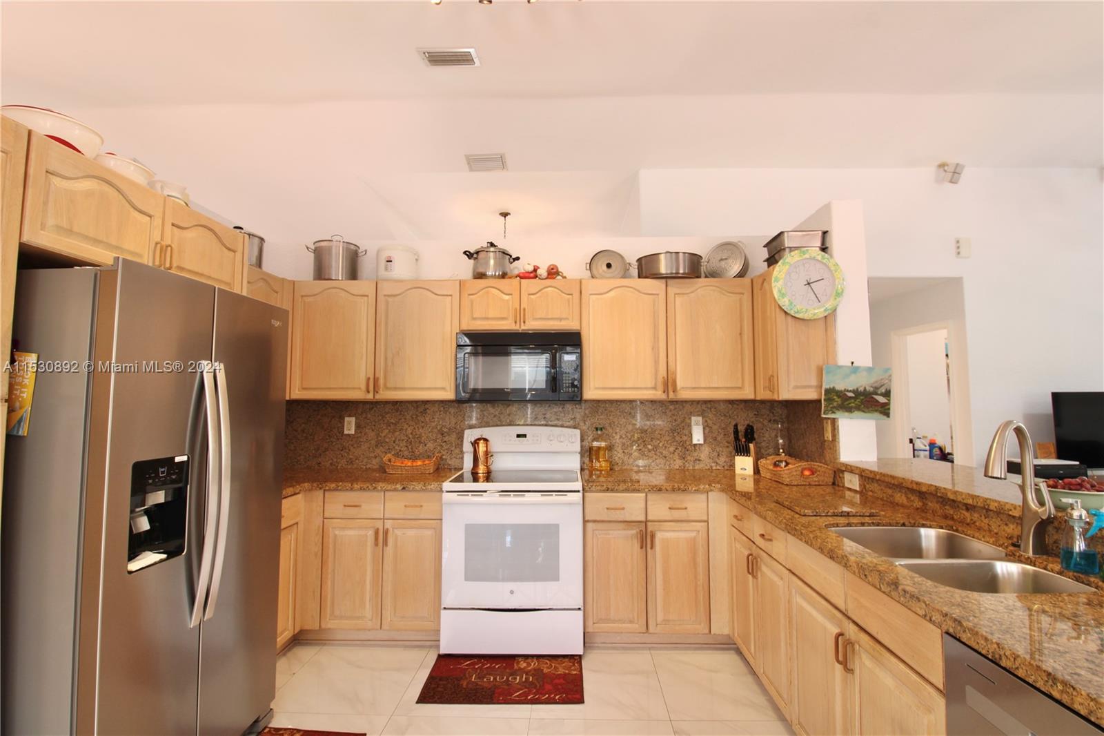 Fully equipped kitchen opens to family room