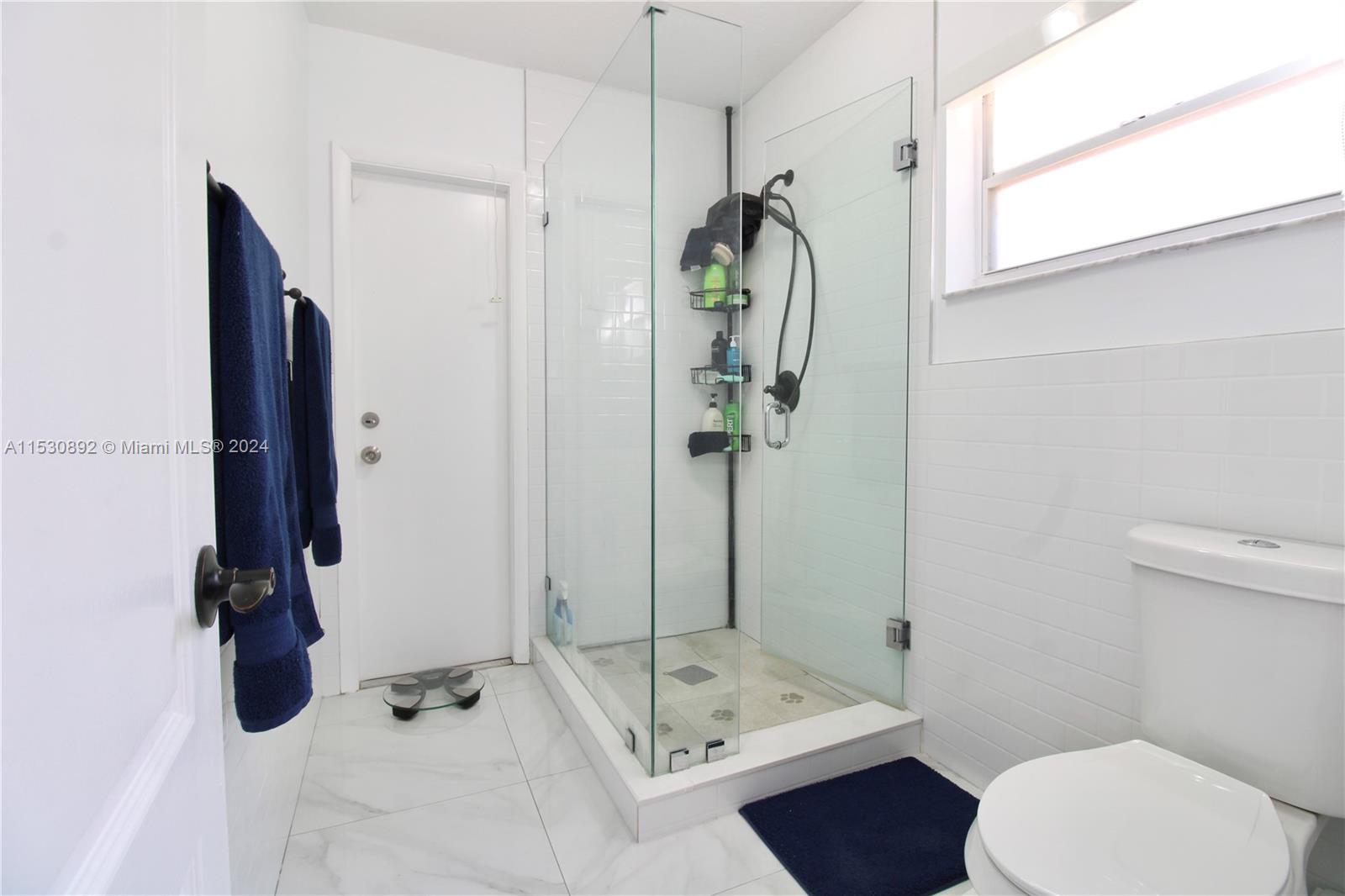 Master bath w/shower, door to pool & patio