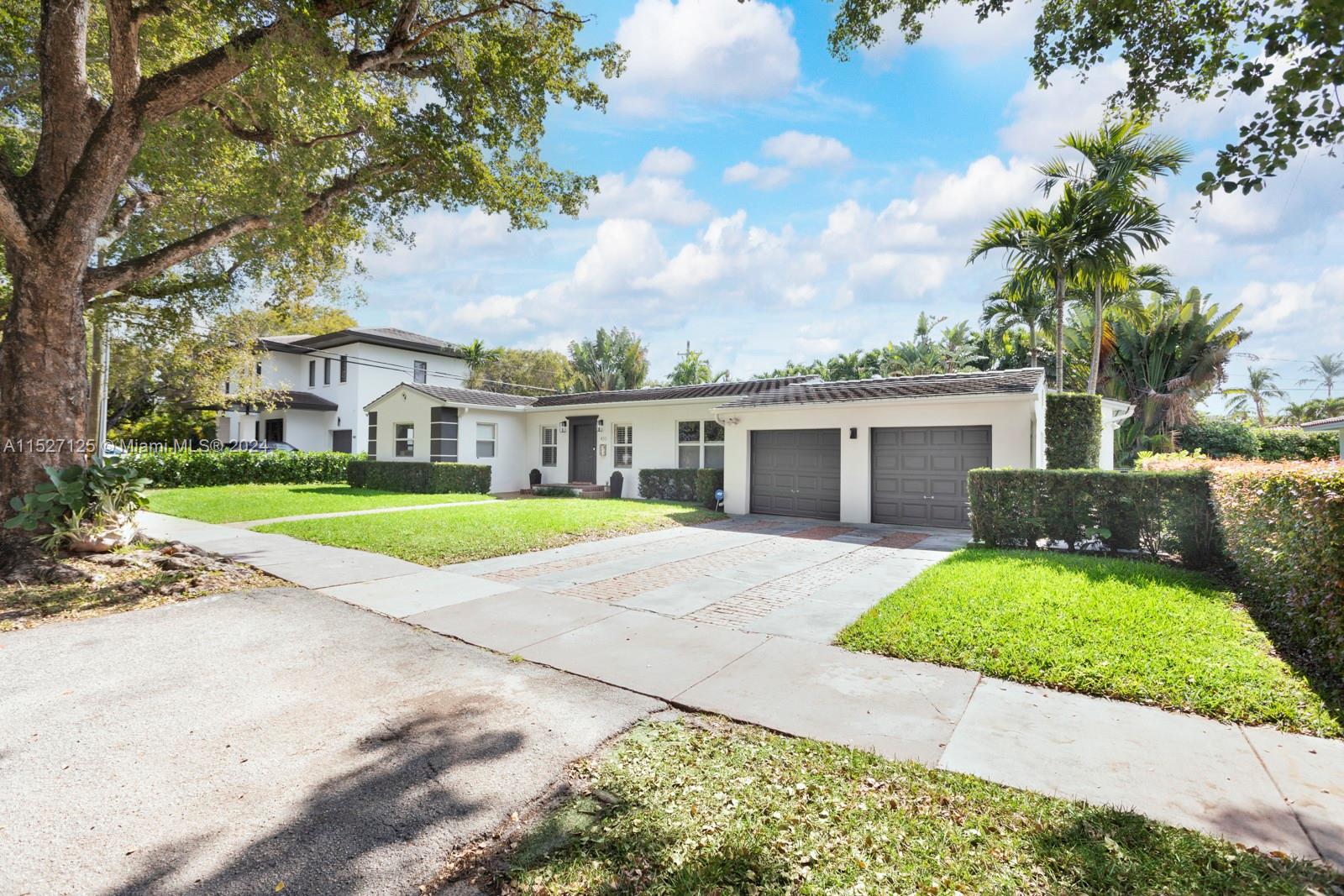 Charming 1-story house at Coral Gables, over a 12.500 SqFt Lot. Spacious living areas, 3 bedrooms with en-suite bathrooms, powder room and small den can be used as a bedroom or office. Modern kitchen with top of the line appliances, Viking gas stove and Oven. Enclosed Laundry room. Serene backyard. Nestled in the heart of Coral Gables, near great schools, parks and dining. amenities. Don't miss this opportunity.