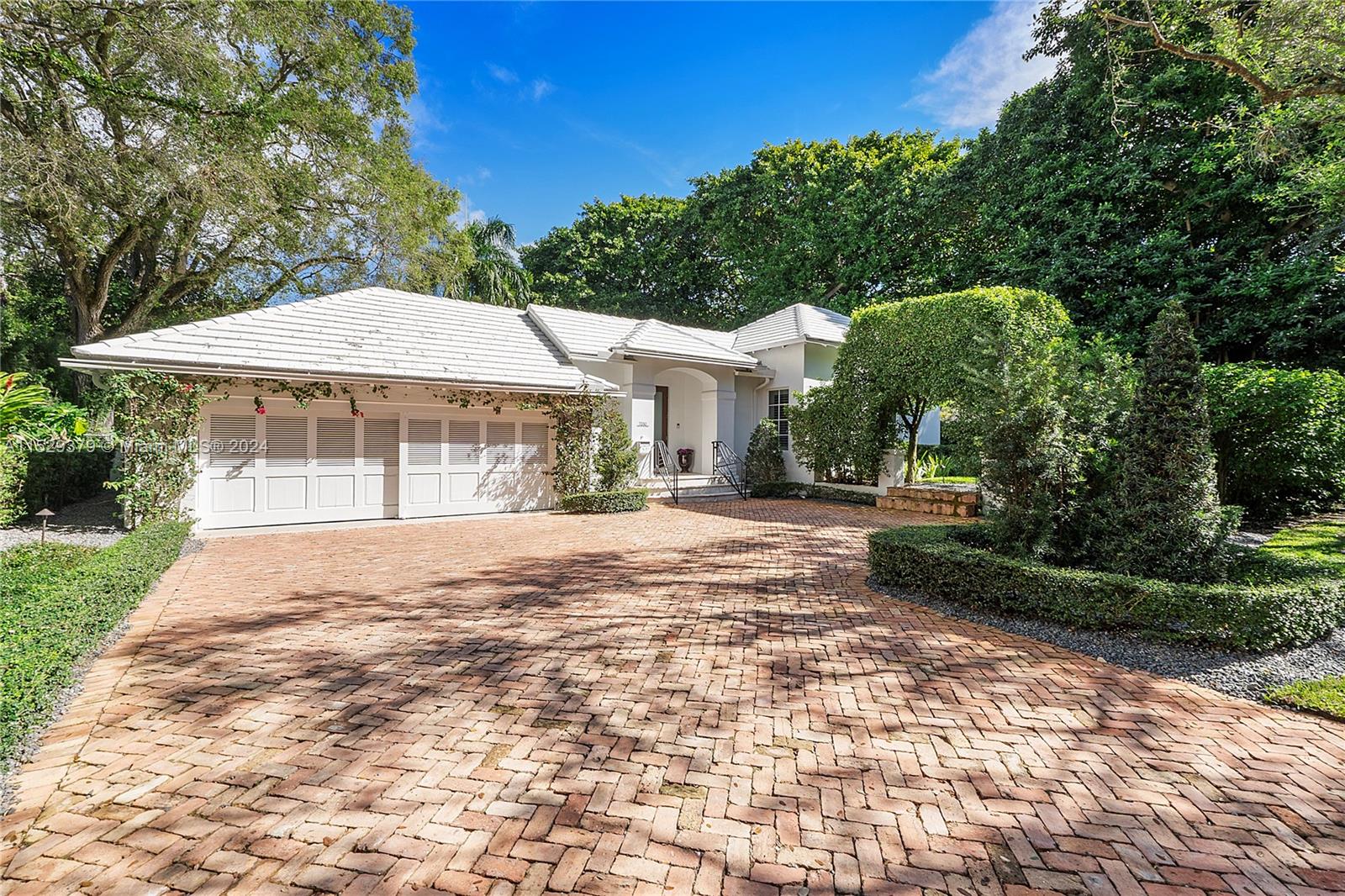 Resting under the banyans of Old Cutler Rd and regal oaks of Tivoli Ave is this stunning 4 bed, 3 bath home. Ideally situated on a 13,877 sf lot, the home boasts 3,638 sf of luxury and comfort. Step into an inviting interior with exquisite finishes like wood floors, and custom built-ins. A spacious layout integrates living, dining, and kitchen areas to create an ideal environment for entertaining and everyday living. The gourmet kitchen has top-of-the-line appliances, custom cabinetry, and plenty of counter space for meal prep. Retreat to the primary suite with a spa-like bath and walk-in closet. Three additional bedrooms provide versatility and space for guests, family, gym, or a home office. The outdoor living space blends with the fabulous courtyard and garden. Great location!