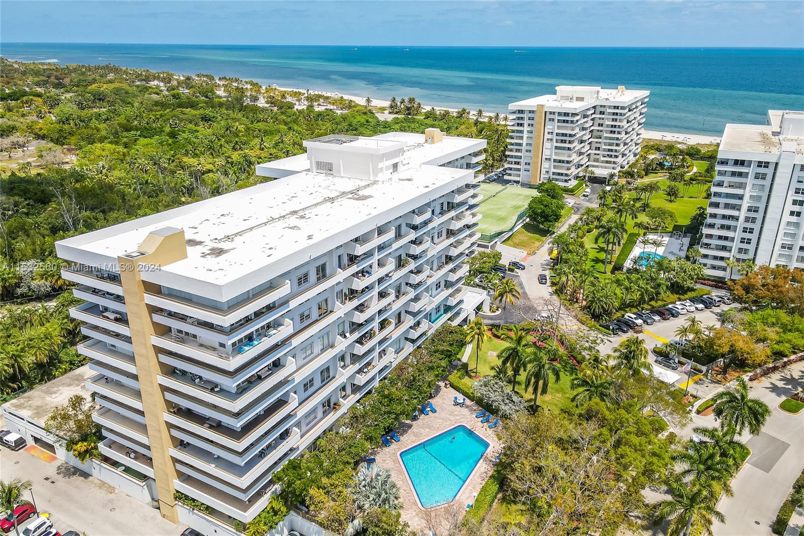 Gorgeous renovated fully furnished 2 bedroom and 2 bathroom unit by famous architect Ramon Alonso at the exclusive Commodore in Key Biscayne. features open kitchen concept with custom cabinets in high-gloss lacquer finish. Engineered wood floors throughout the unit. The primary bedroom with en-suite remodeled bathroom with double sinks and plenty of storage. Comes with one assigned and covered parking space. Commodore Club is a very well-maintained building with many amenities such as direct and private beach access where umbrellas and chairs are provided, tennis courts, a heated pool, exercise room, and more. Don't miss this opportunity. Short term rental allowed minimum 90 days.