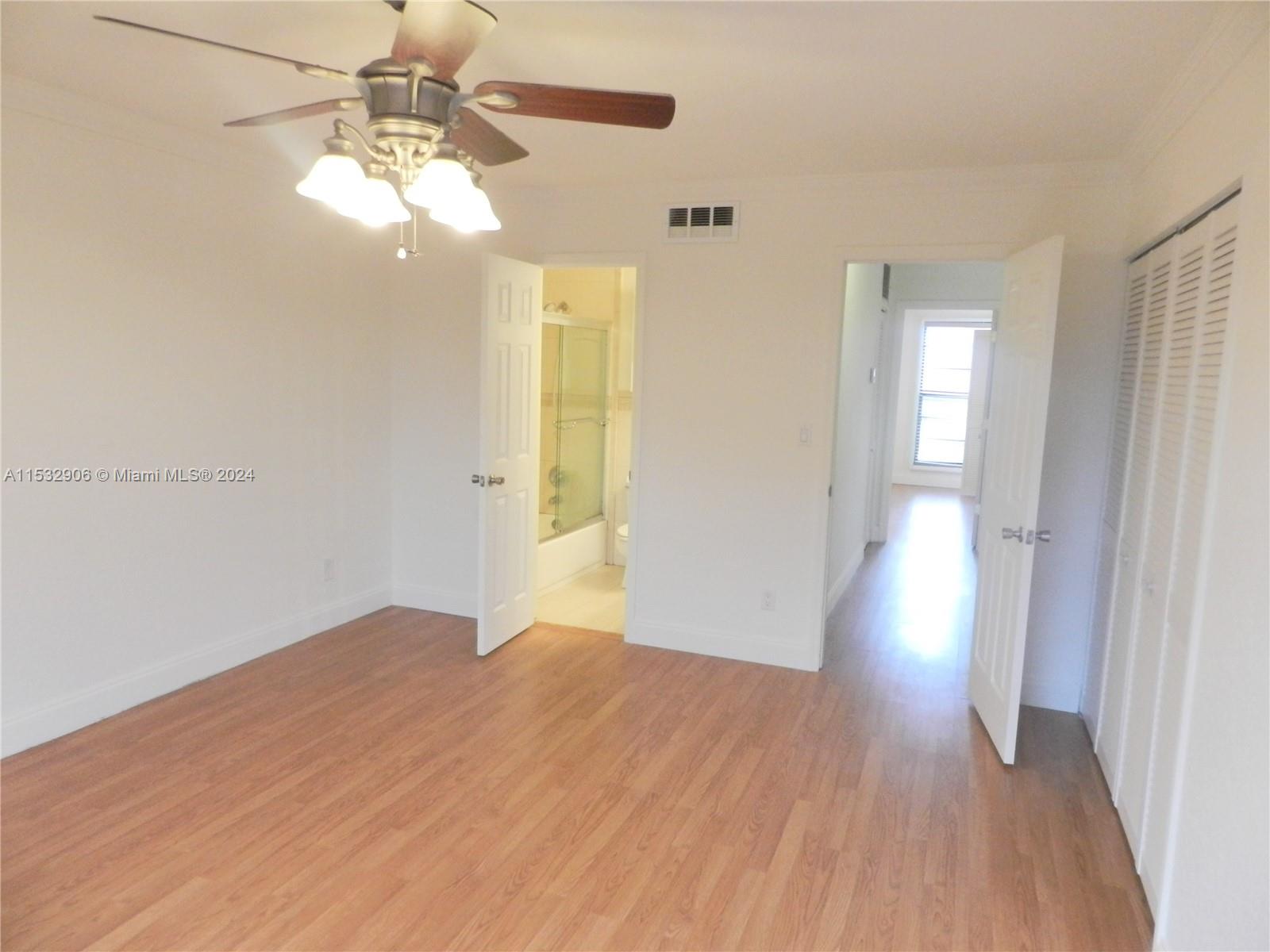 Ample cabinets with a pass through into dining room