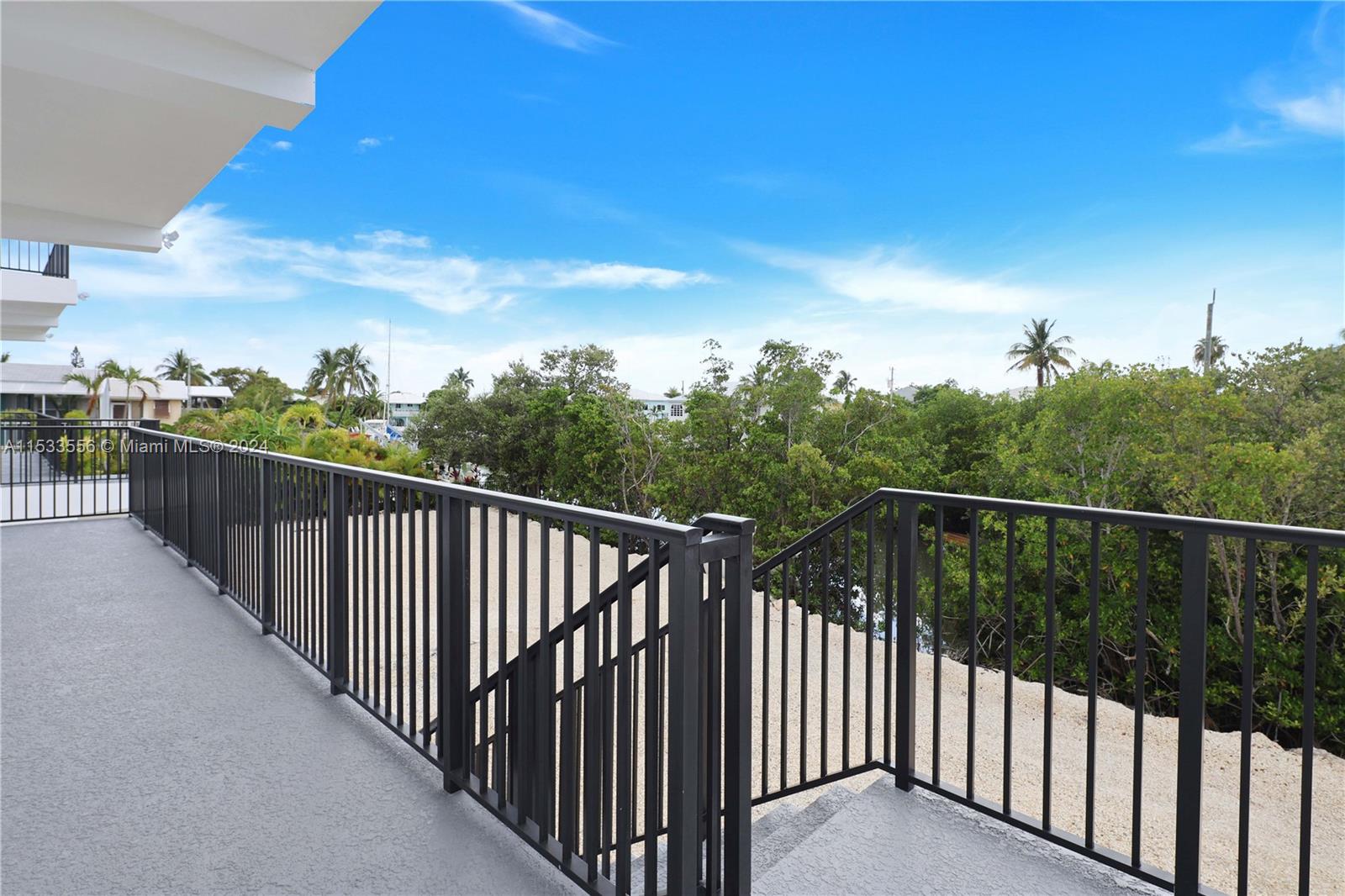 1st Floor balcony with stairs to the backyard