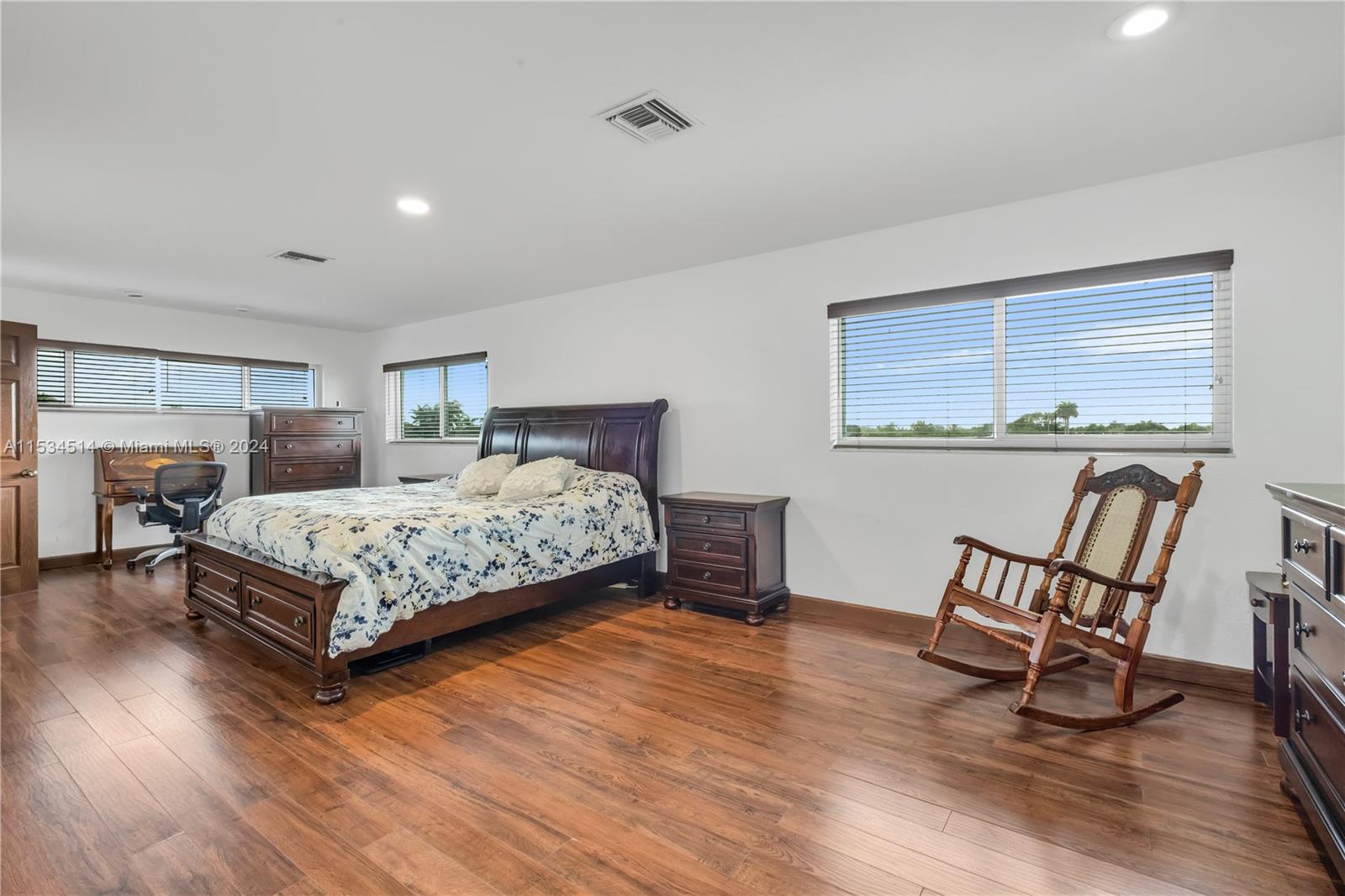 Principal bedroom with view of walk-in and bath