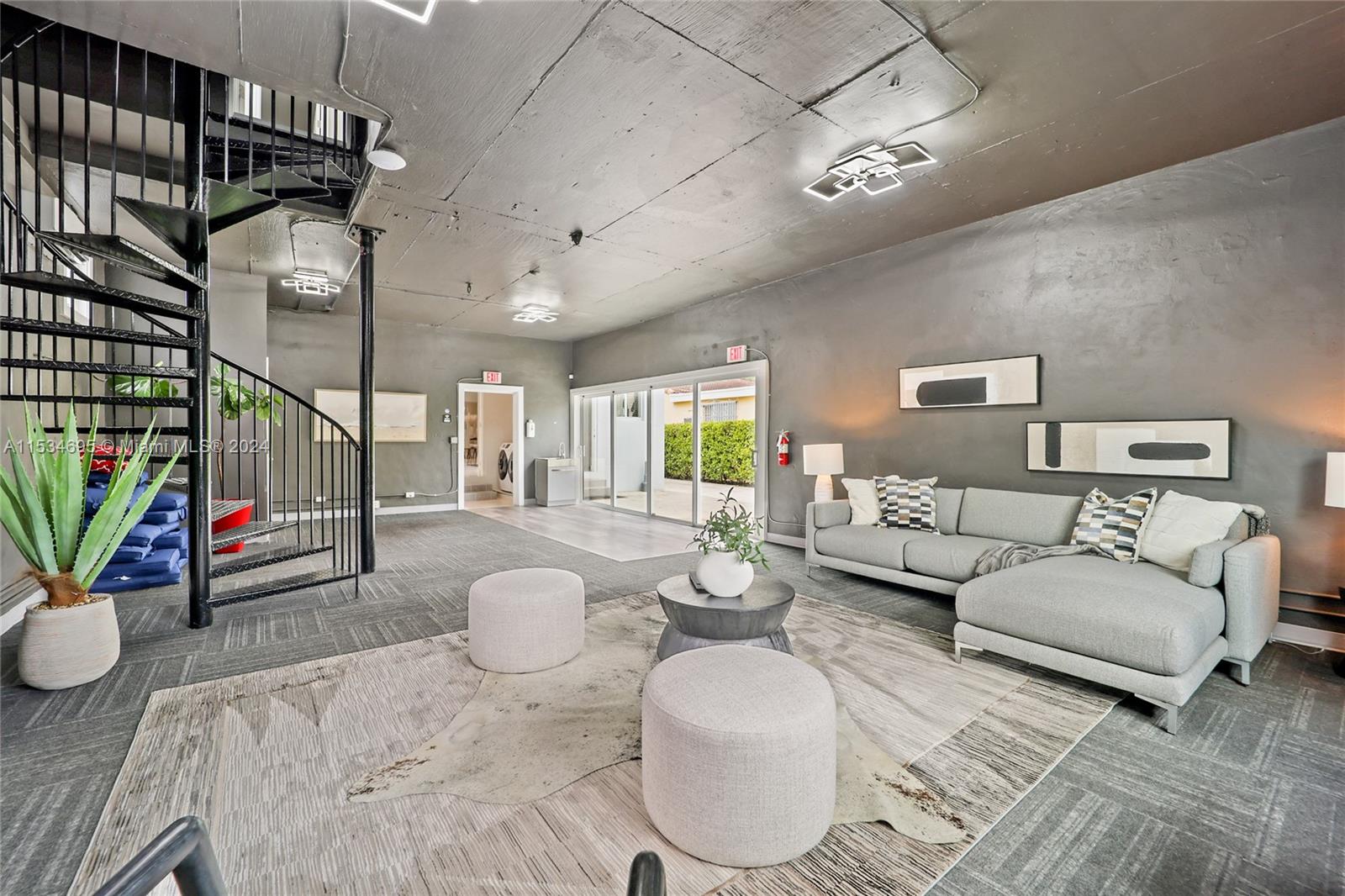 Spiral Staircase leading to Guest Studio upstairs with balcony.