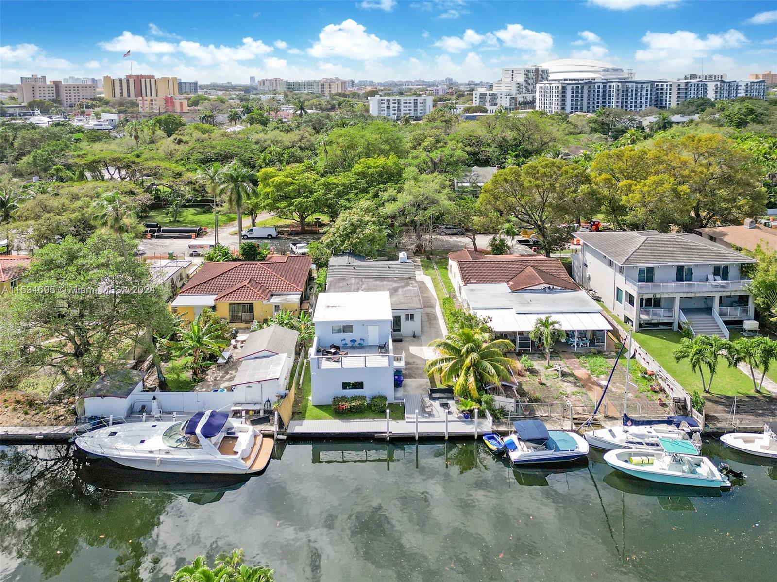 Extension of original house clearly viewed, with balcony and dock waiting for a boat!