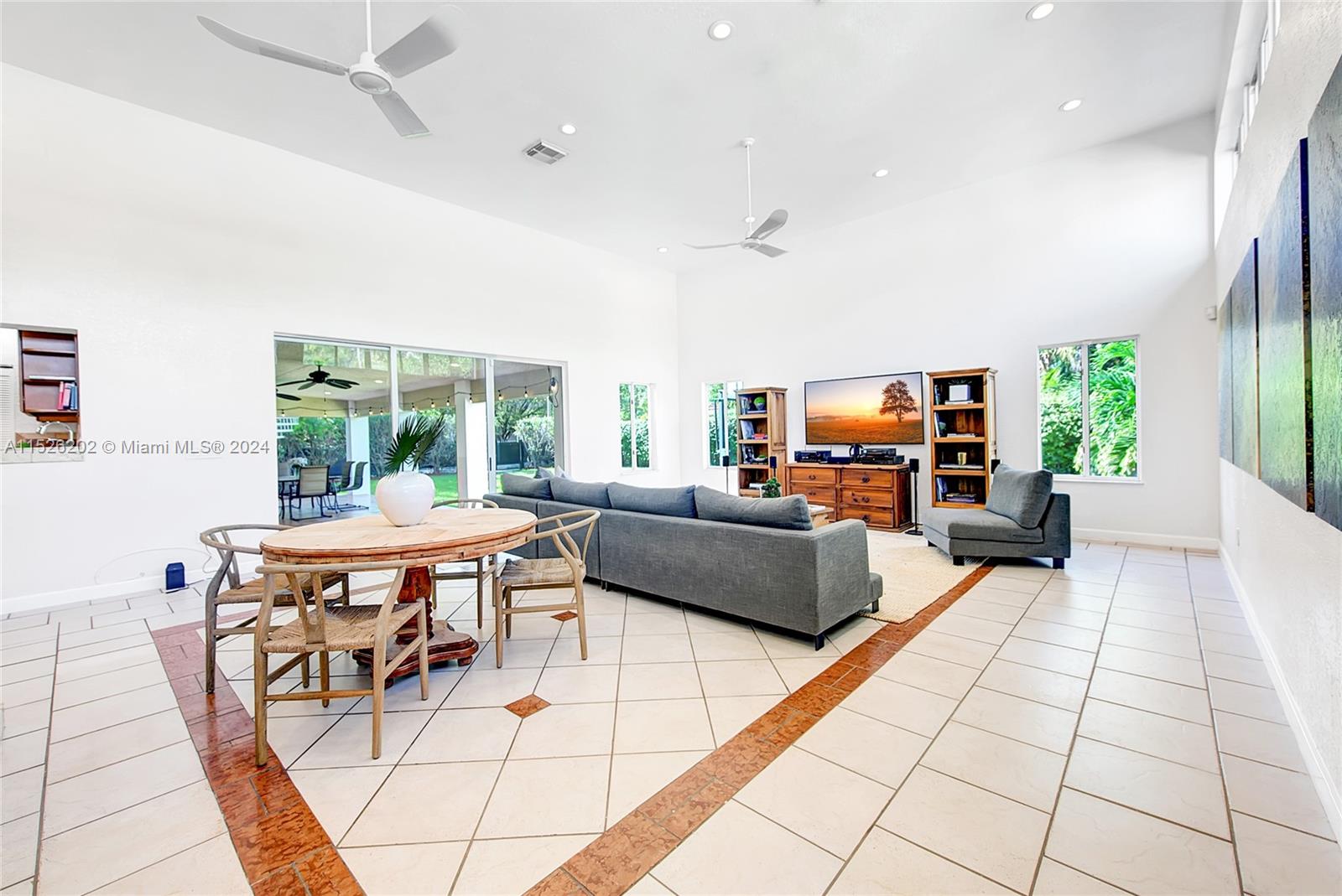 Fabulous gated 5BR/5BA home w/ 5,200 sq ft living space in The Roads/Brickell Hammock. Corner double lot, 2 blocks from ocean, entrance to Brickell, Key Biscayne & Coconut Grove. Outdoor views & white tile floor, formal living & dining rms, office, huge family rm w/14ft ceiling/sky views. BR's w/walk-in-closets, hardwood floors, marble baths. Upstairs master suite w/balcony, separate sitting room, & luxury bath w/jacuzzi. Kitchen w/granite counters, wood cabinets, steel appliances. Covered terrace, basketball court, large backyard lawn w/ separate drive-through gate. Security system w/ cameras, 2x 5-ton AC's, 2x remote controlled electric gates, secure 5x car driveway with covered carport, electric car charger & irrigation system.