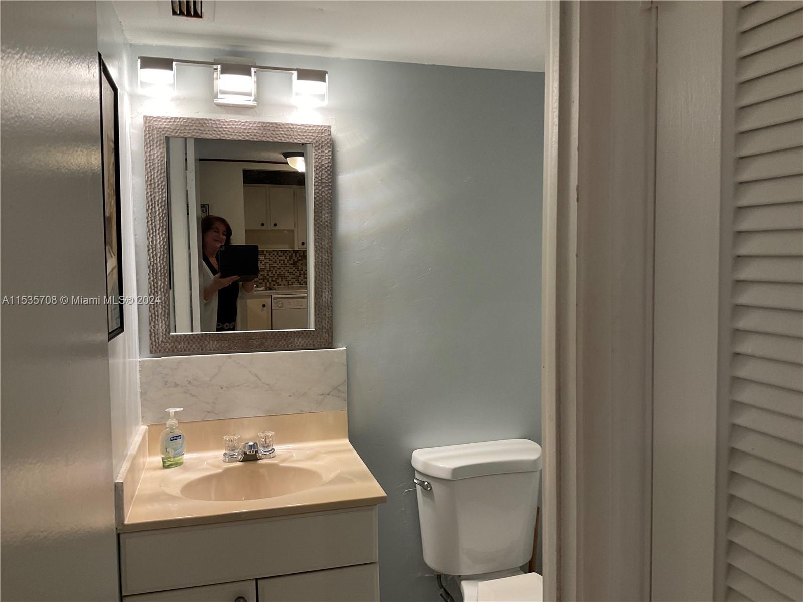 Half Bath by Living Room.