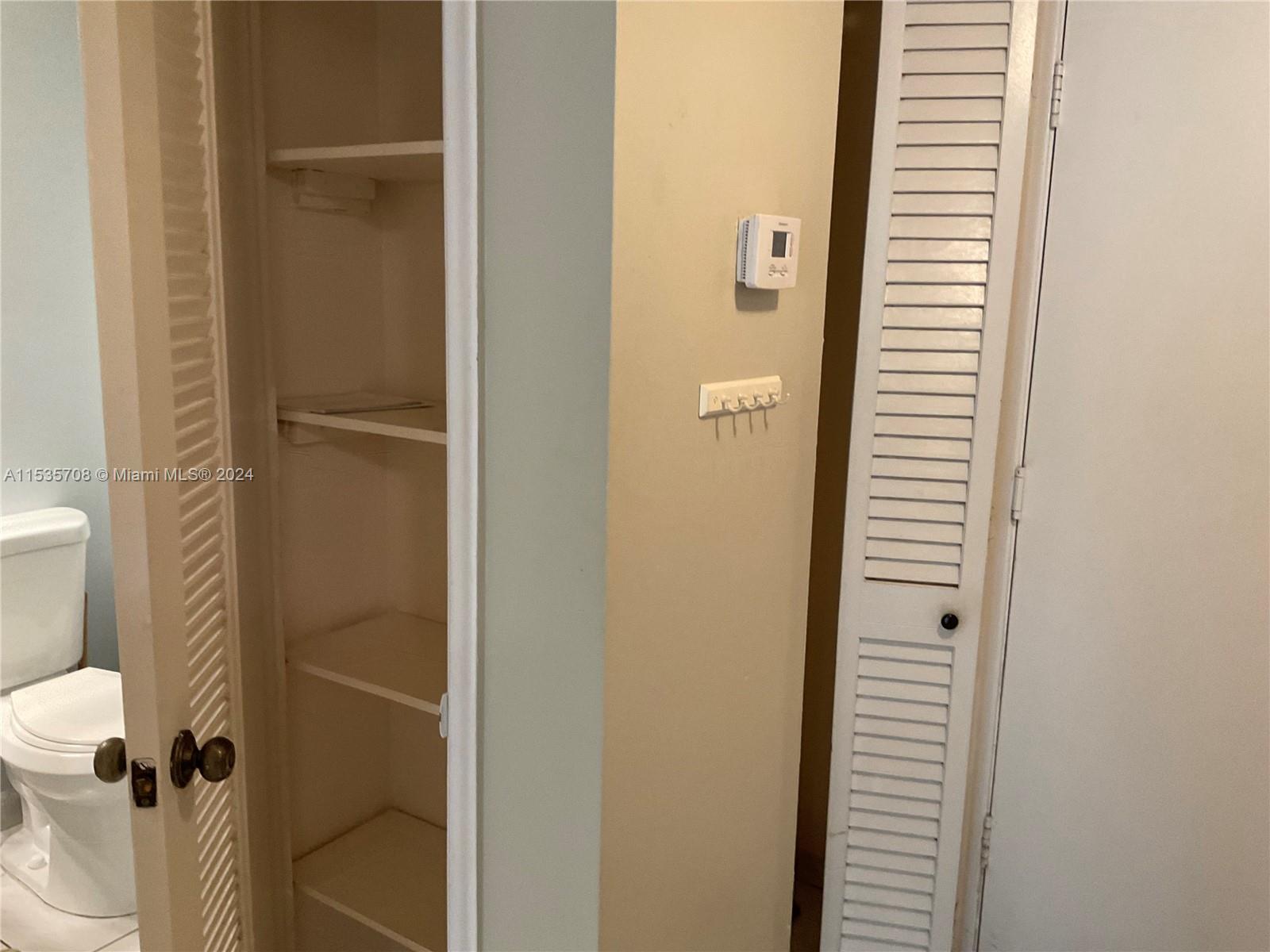 Closet near half bath by entrance.