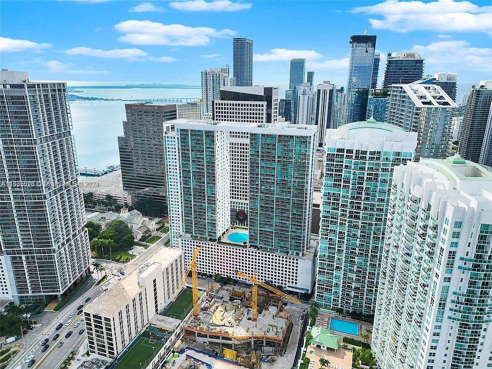 Ready for immediate occupancy, this partially furnished split floor plan. Located in the vibrant heart of Brickell, this 2 bed/2 bath corner unit apartment boasts an inviting entrance foyer. Nestled within walking distance of essential amenities such as Whole Foods, the prestigious Citi Center, and the scenic bay, convenience is at your fingertips.  just steps away from the Metro Rail provides unparalleled accessibility. The building itself is a luxury living, offering concierge front desk service, 24-hour security, and rooftop pool. Stay fit in the fully equipped gym, relaxing spa, or catch a movie in the on-site theater. Please note, the apartment is partially furnished. It's important to mention that there is ongoing construction across the street. EASY TO SHOW