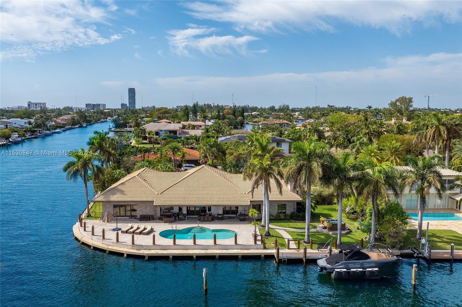 Welcome to 655 Hibiscus Drive in the exclusive gated community of Golden isles in Hallandale Beach. This one-of-a-kind point lot home features 220 FT of water frontage and sits on nearly 20.000 SF of land. Located on the community's widest canal, this property is perfect for your 150FT+ vessel. Home features include over 5.000 SF of living space with 6 bed, 5.5 bath, several living rooms, office and a serene outdoors that provides a resort style pool/spa with outstanding water views. No fixed bridges! Call Listing agent Alan Chocron for showings.