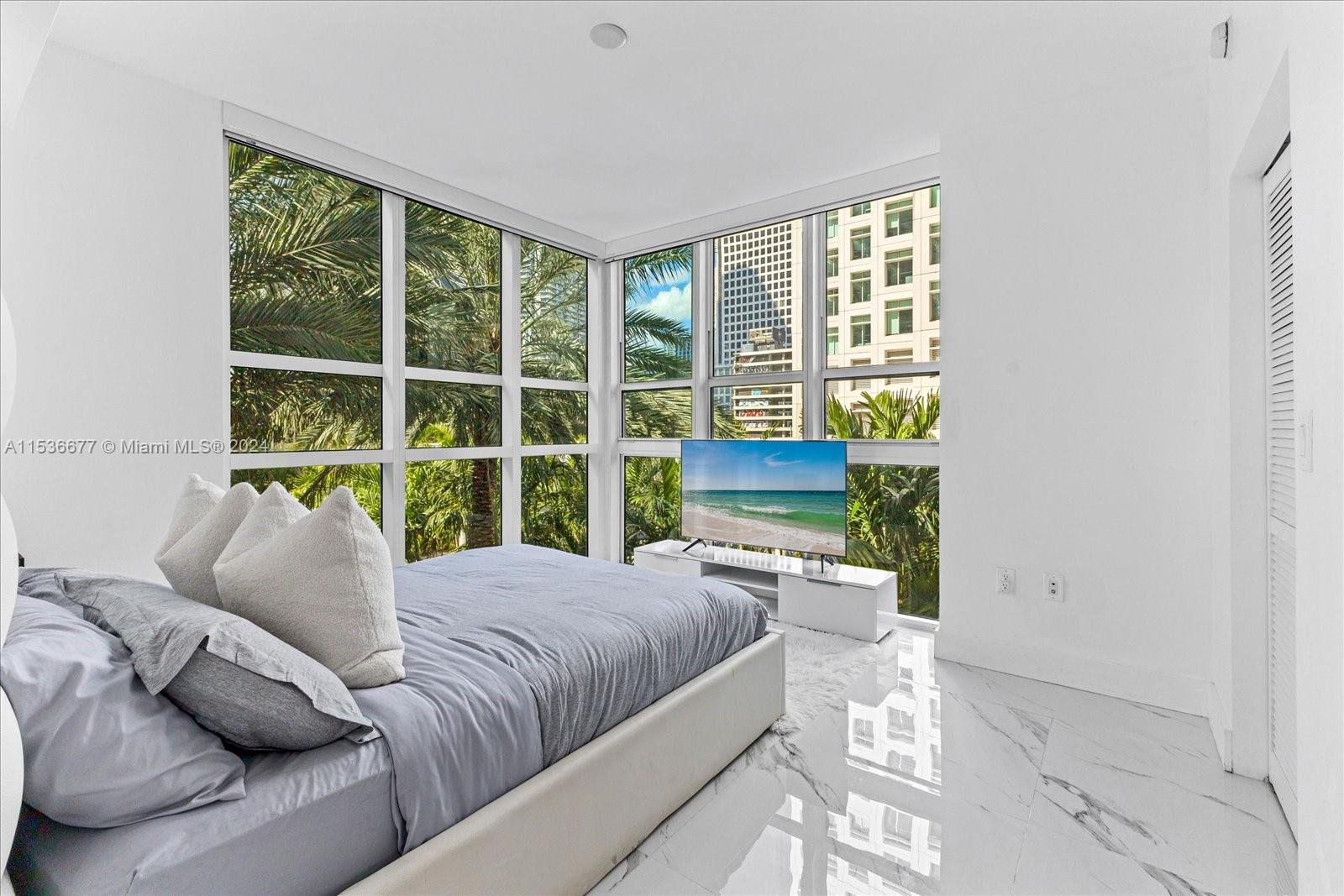 Beautiful corner unit completely renovated and designed in the heart of Brickell! Brand new kitchen & bathroom, porcelain tile flooring throughout entire unit, stainless steel appliances, washer/dyer, black out curtains and spacious corner balcony over looking lush palm trees. Building also offers state of the art amenities such as two amazing pools with cabanas, exercise room, steam room and business center. Conveniently located within walking distance of banks, shops at Brickell City Center, parks, restaurants, downtown and much more.